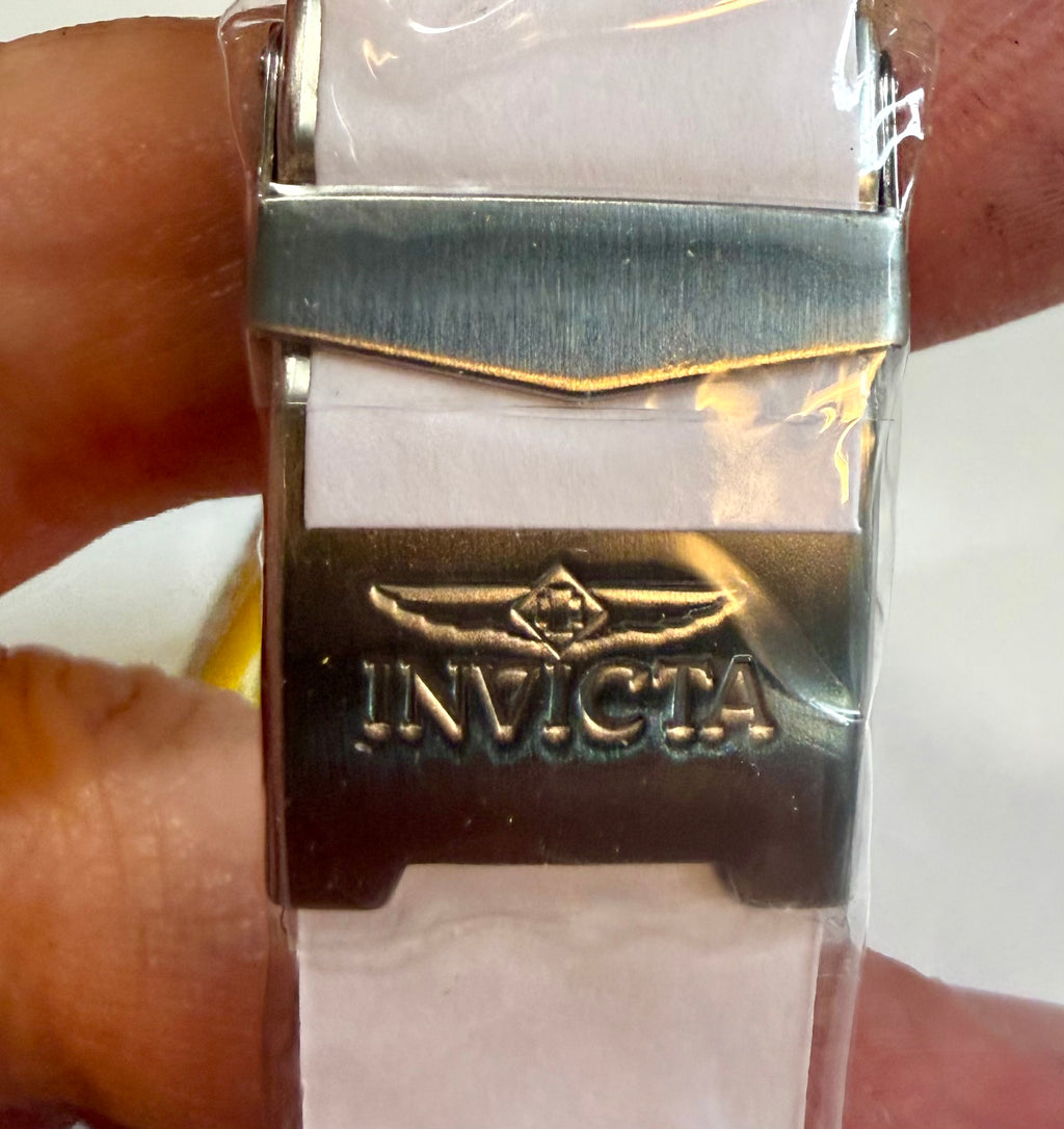 Invicta Mens Pro Diver 43mm Heritage strap with logo on a clear plastic bag, held by a hand.
