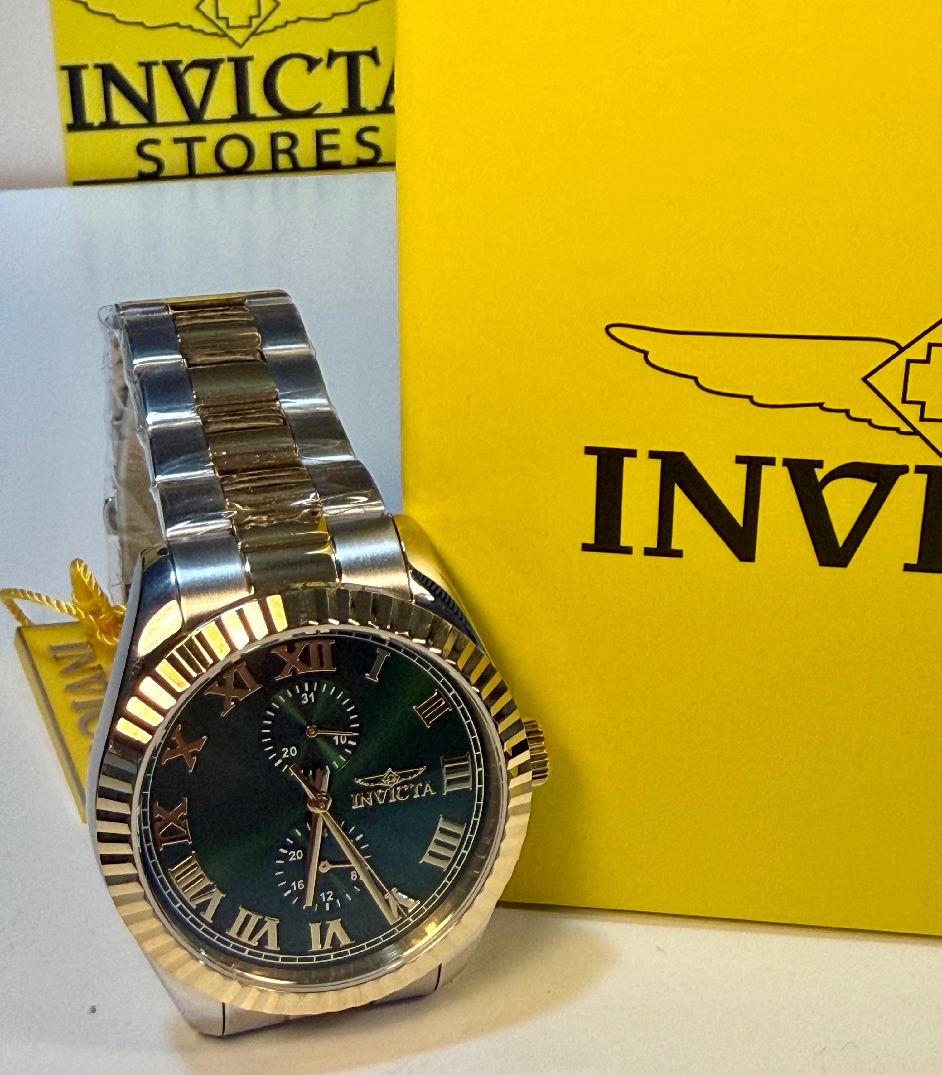 Invicta Mens Specialty Belmont 43mm Silver and gold watch with green face on a yellow Invicta box