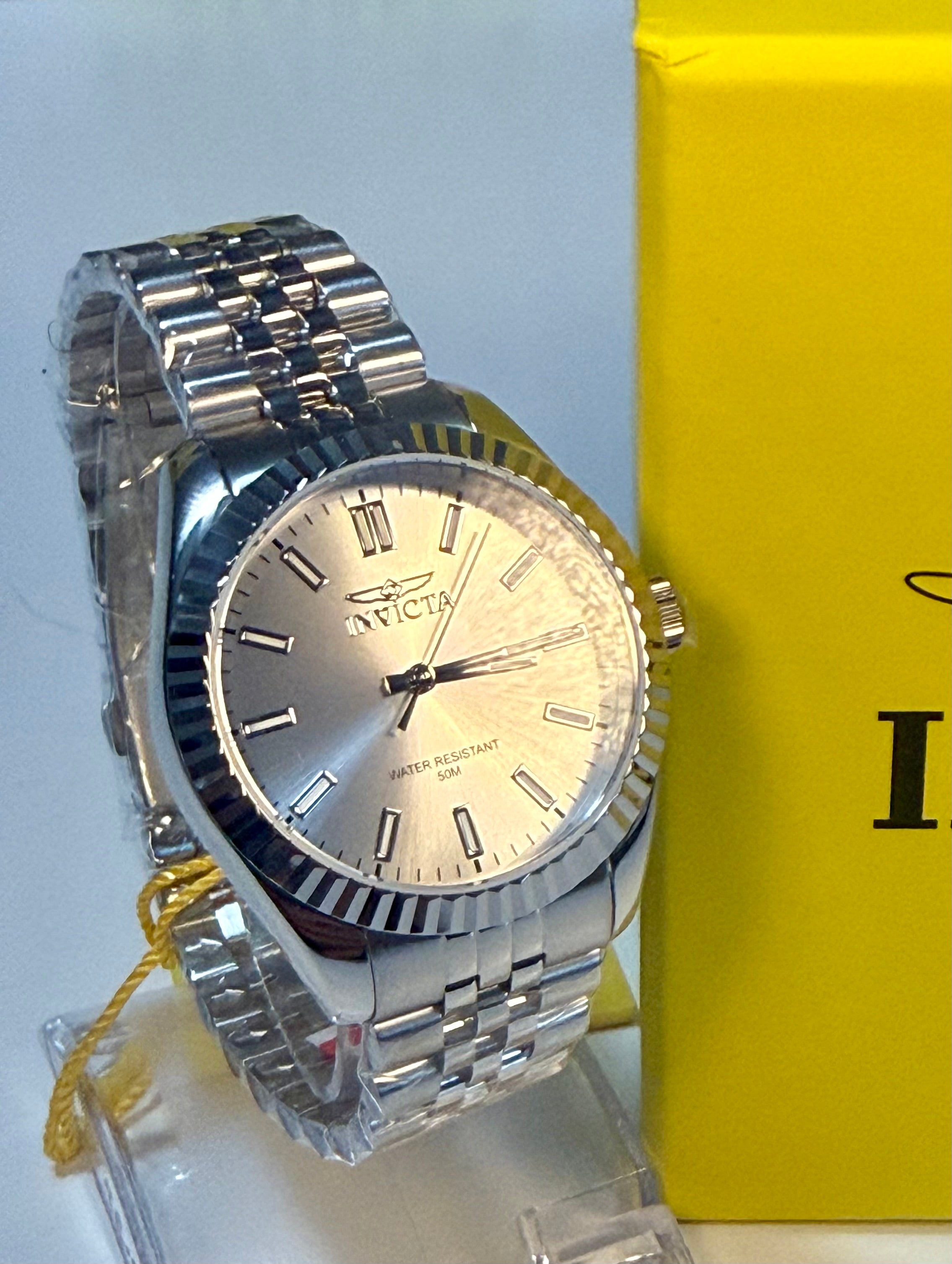 Invicta Ladies Specialty 36mm watch with a yellow box on a light gray background