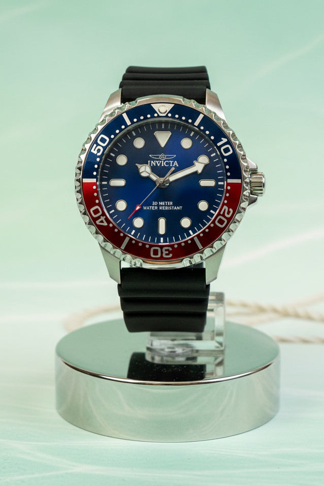 Invicta Mens Pro Diver 48mm Silicone band watch with black strap and colorful bezel on a white backgroundm