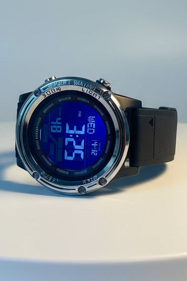 Activa Voyager Digital watch with blue screen on a white surface, branded as Invicta.