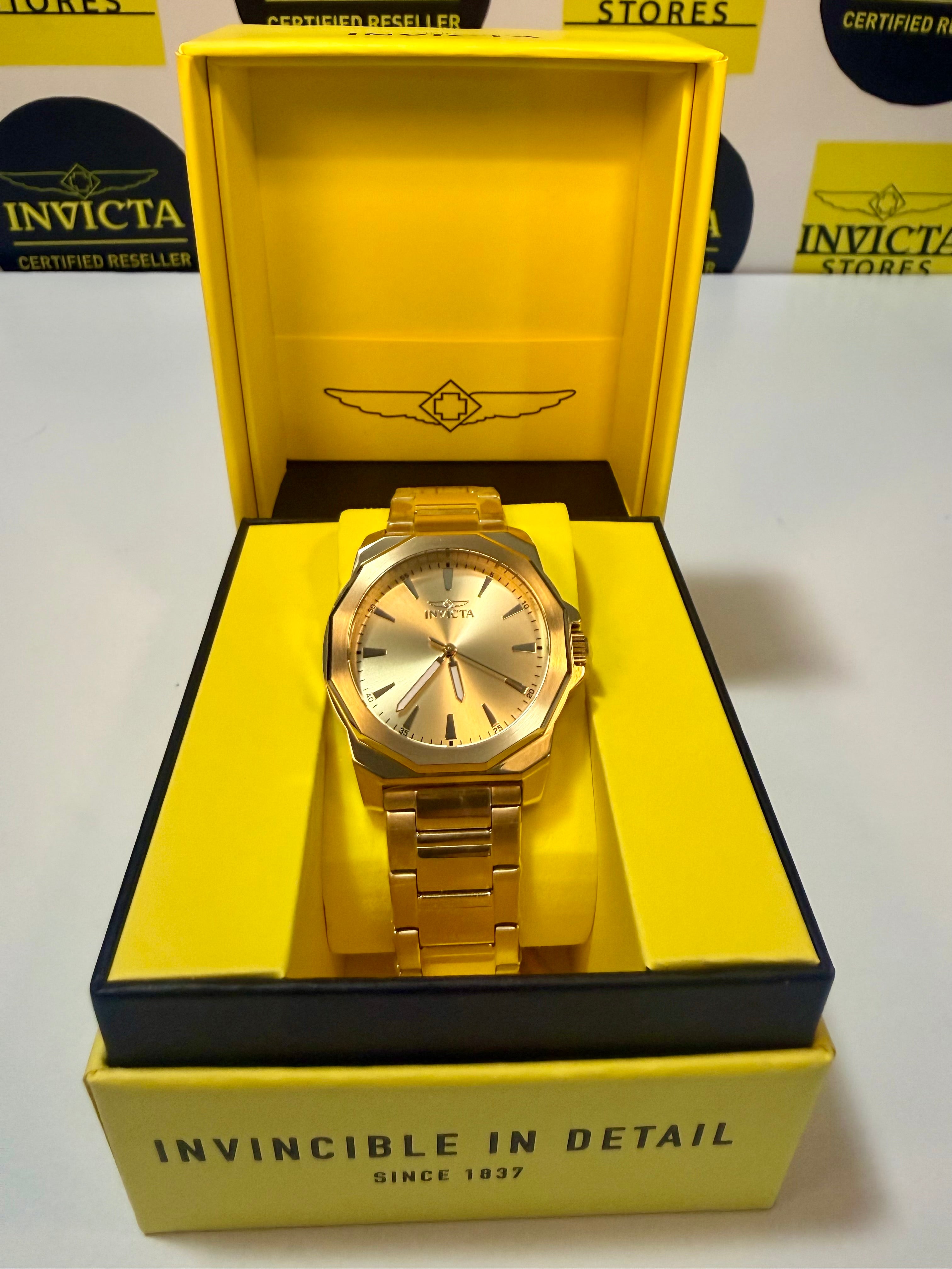 Invicta Speedway 46840 Gold Dial Gold Plated Steel 42mm Quartz Men's Watchin a yellow box with 'Invicta' branding.