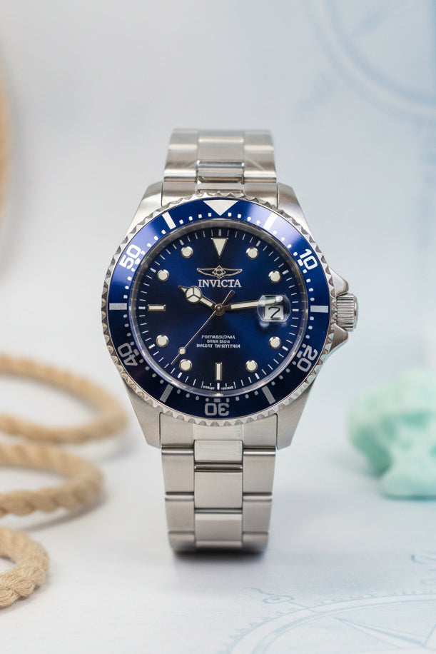 Mens 43mm Pro Diver Silver watch with black face on a white background, Invicta box visible.