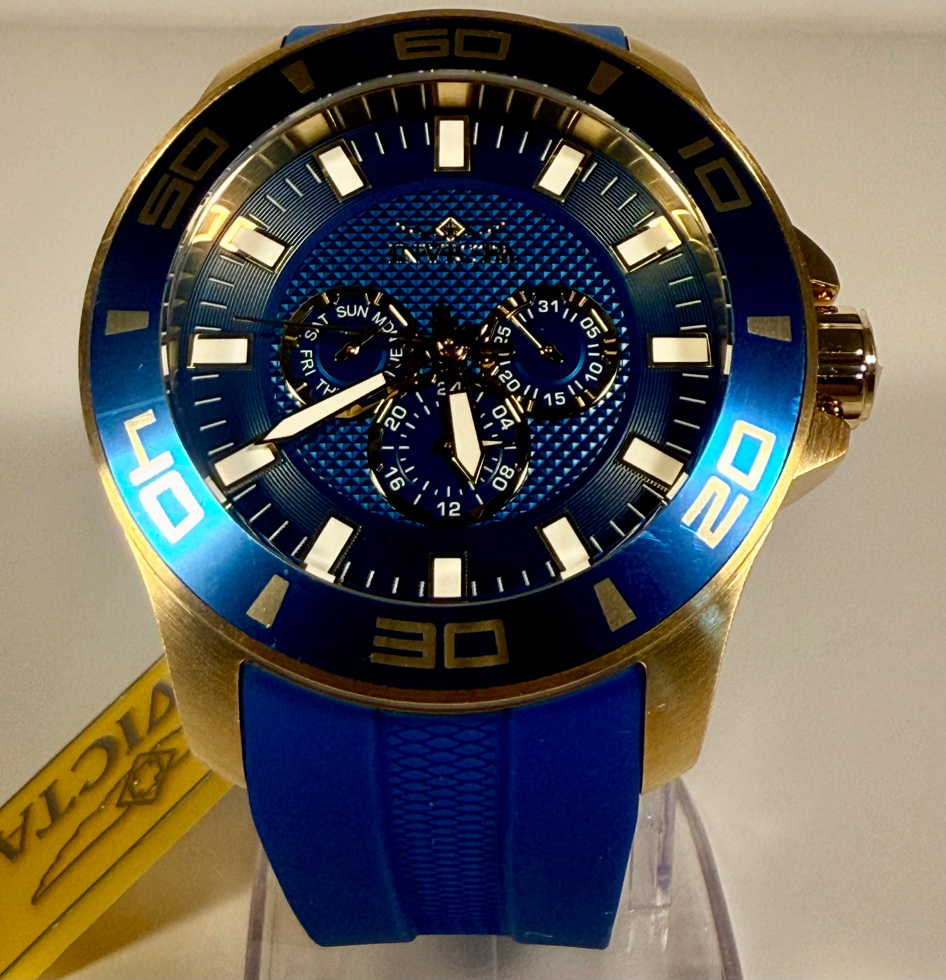 28002 Invicta Mens Pro Diver Impact Blue Dial Gold Tone Silicone 50mm 100m Watch on stand