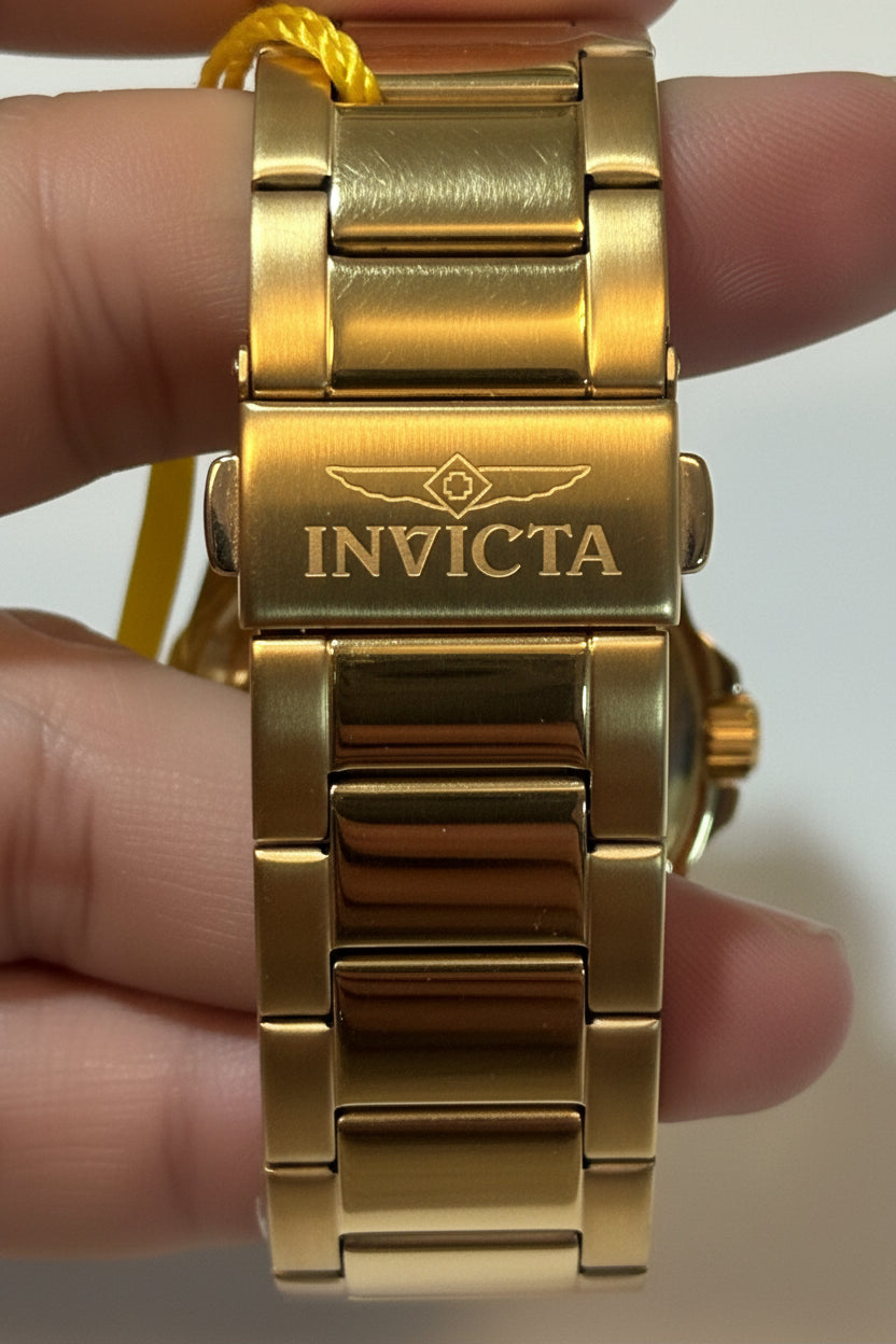 Invicta Speedway 46840 Gold Dial Gold Plated Steel 42mm Quartz Men's Watchon a wrist with a plain background