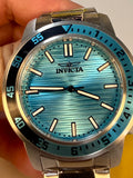 Invicta Specialty Gramercy 45mm Mens watch with blue face and silver case held by a hand