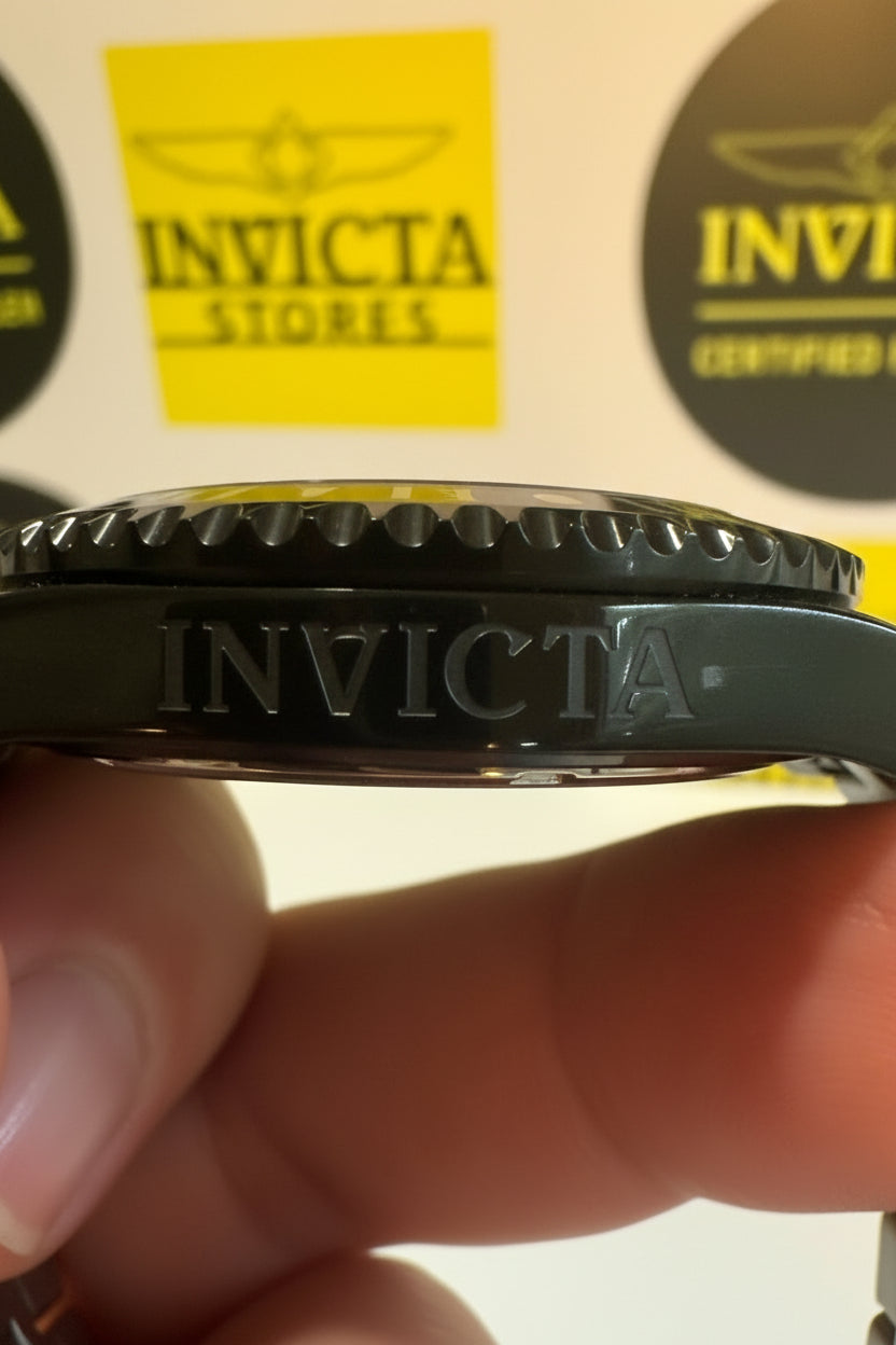 Invicta Mens Pro Diver Black and blue  watch case held between fingers with Invicta branding visible