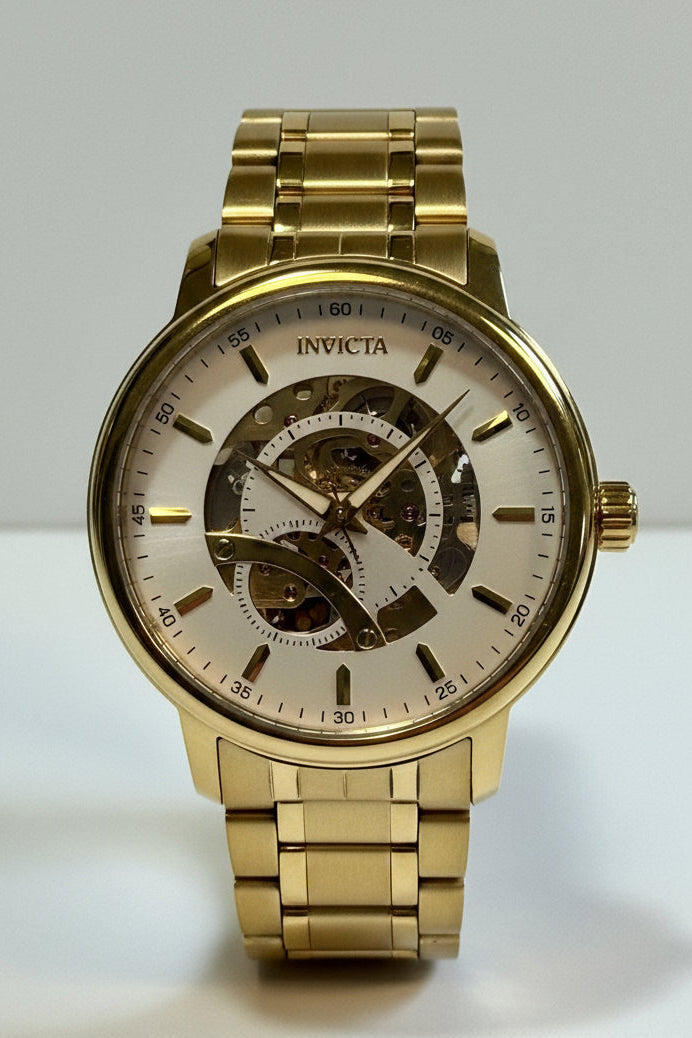 Invicta Mens Automatic Objet' De Art Gold wristwatch with a visible brand name on a white background