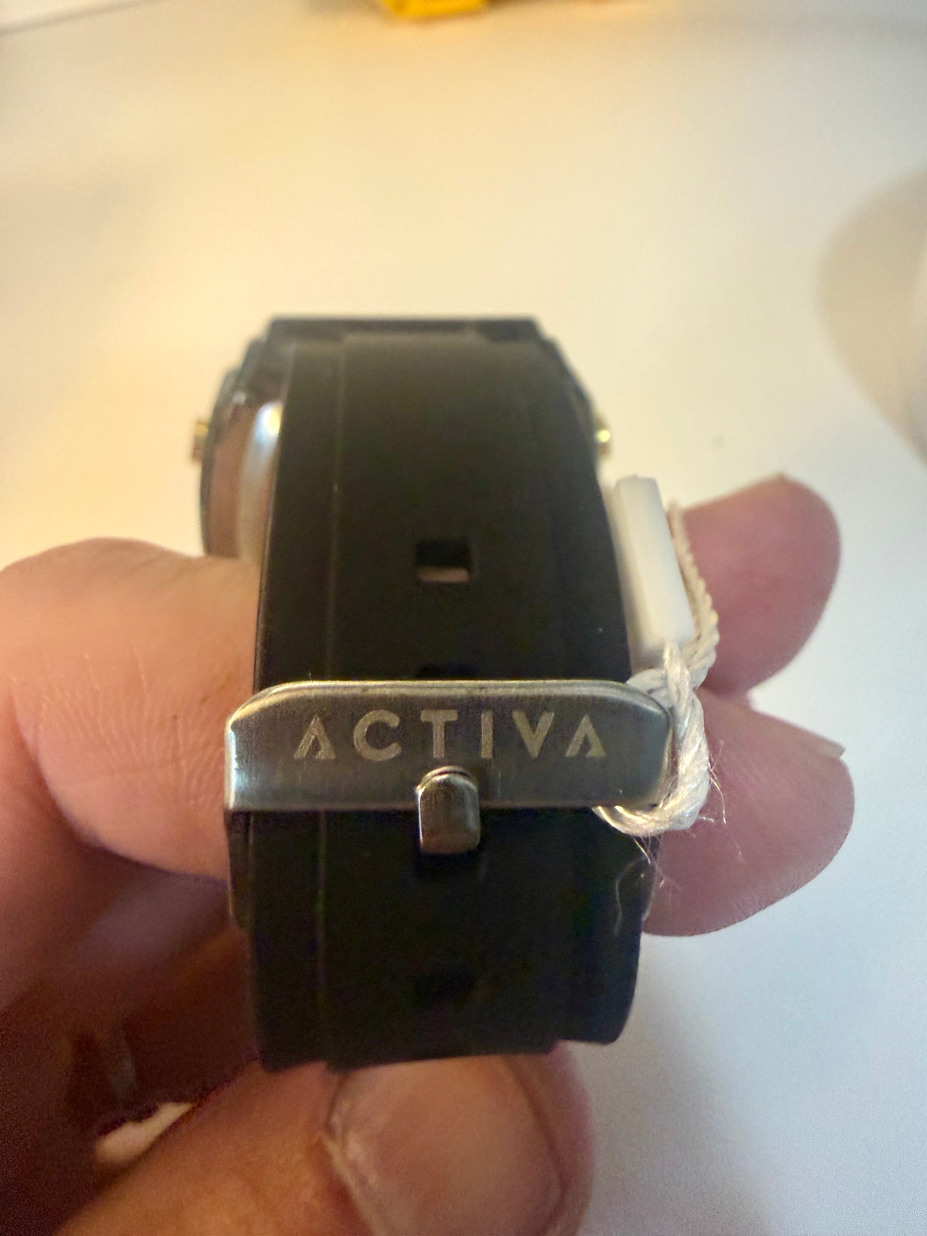 Activa X Ranger Bundlewatch with 'Activa' brand name held in a hand on a light background