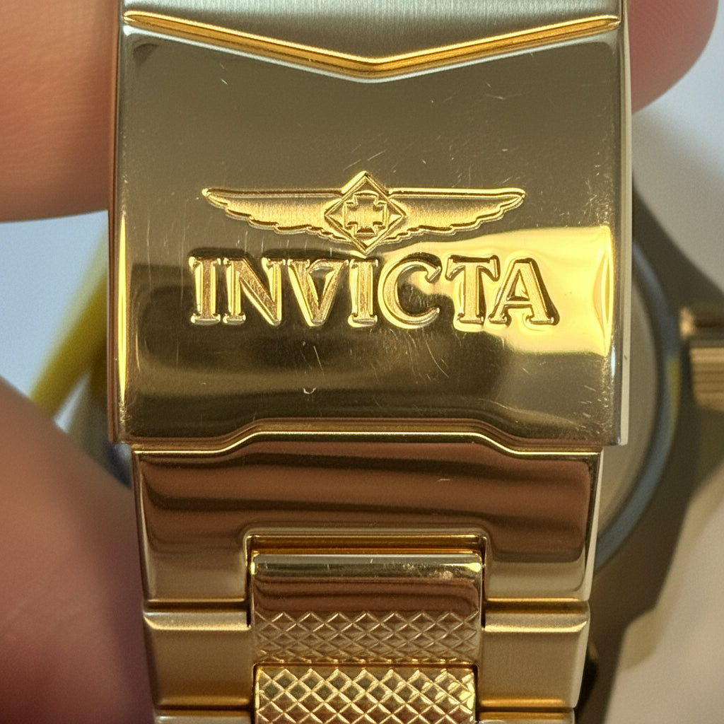 Gold Invicta Speedway 48mm watch band with brand logo on a white background
