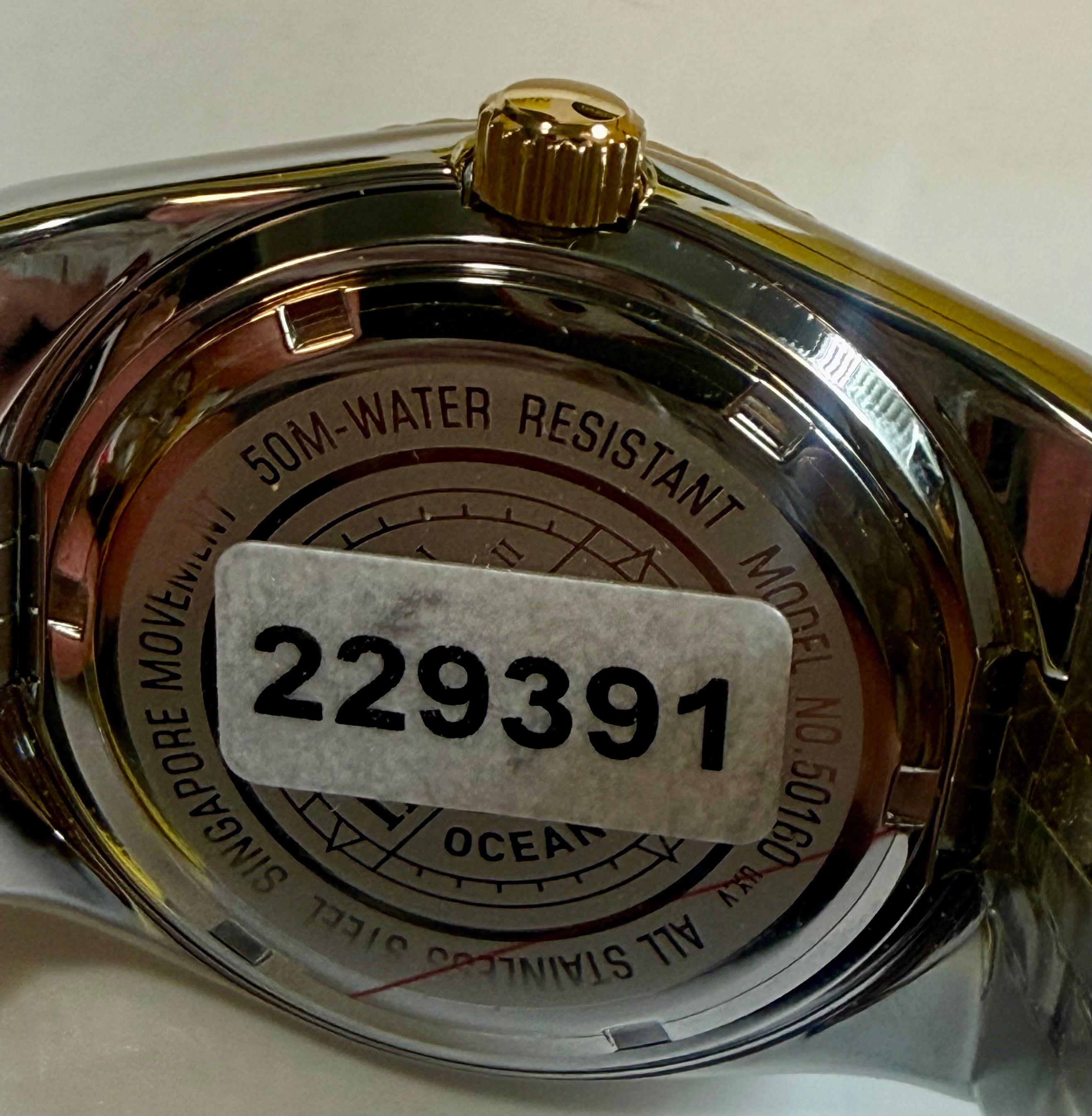 Back of a Invicta Ocean Voyage 38mm Pro Diver watch with '50M Water Resistant' and model number '229391' on a white background