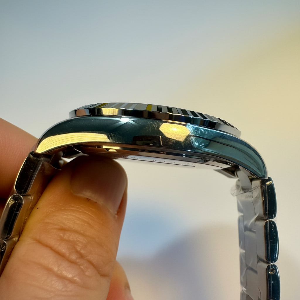 Close-up of a person holding a Invicta Specialty Stratford watch band with a blurred background