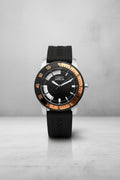 Invicta Specialty Compas in Bronze Black Invicta watch with a silver bezel on a light gray background