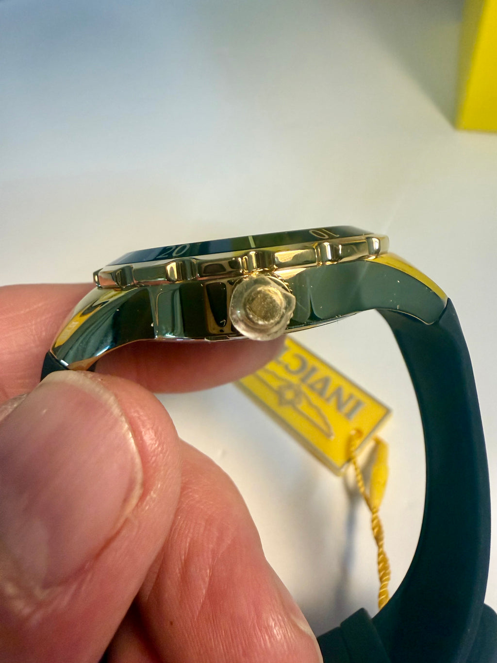 Invicta Ladies Angel Gold watch band with a visible brand tag on a white background