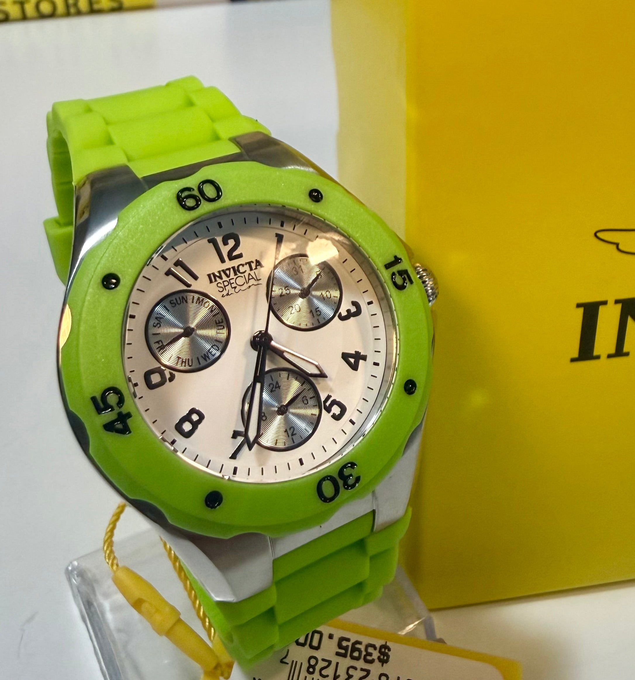 Invicta Unisex 38mm Angel  with silver accents on a white surface next to an Invicta box.