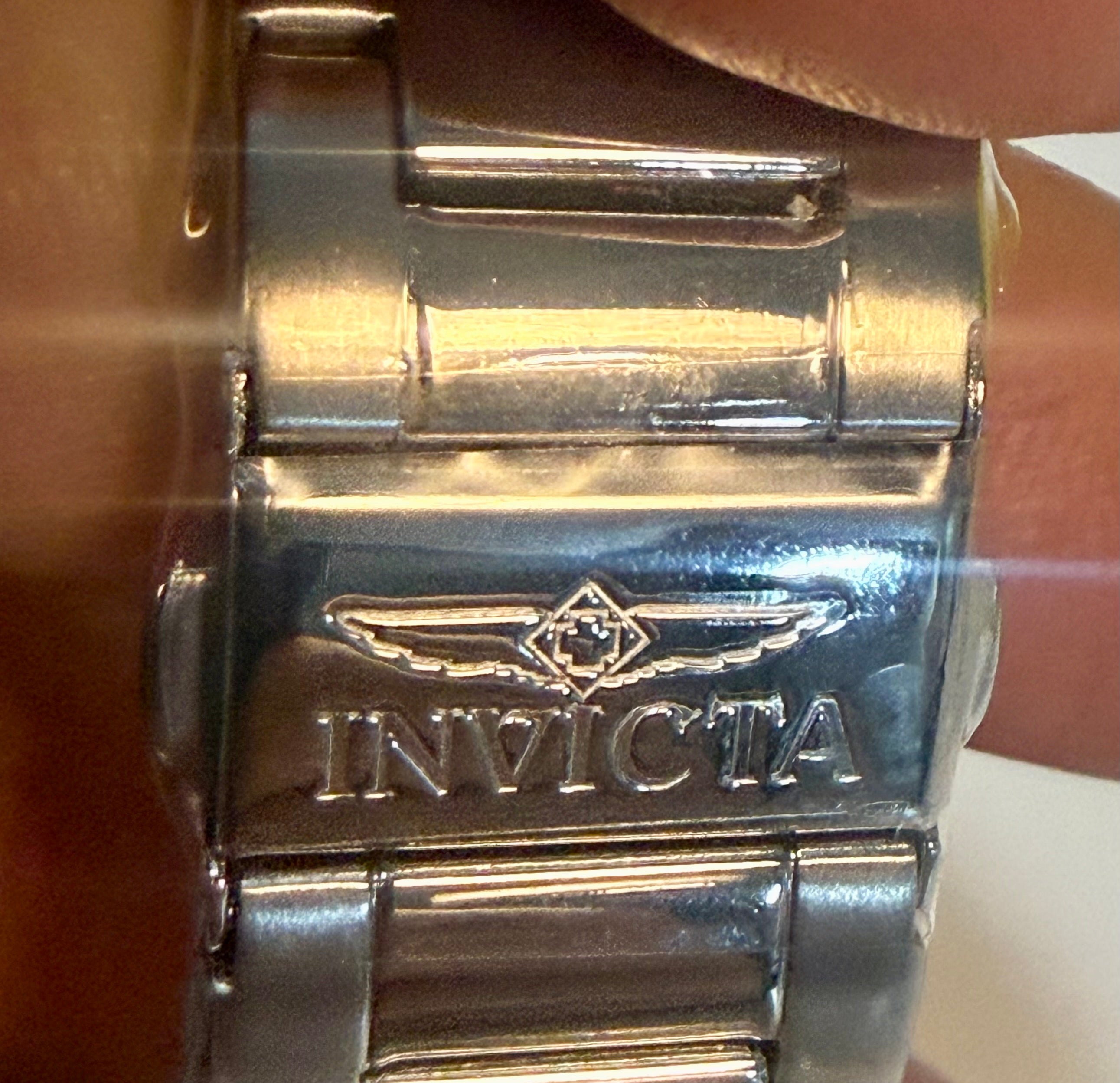 Close-up of aInvicta Ocean Voyage 41mm watch band with clear plastic cover