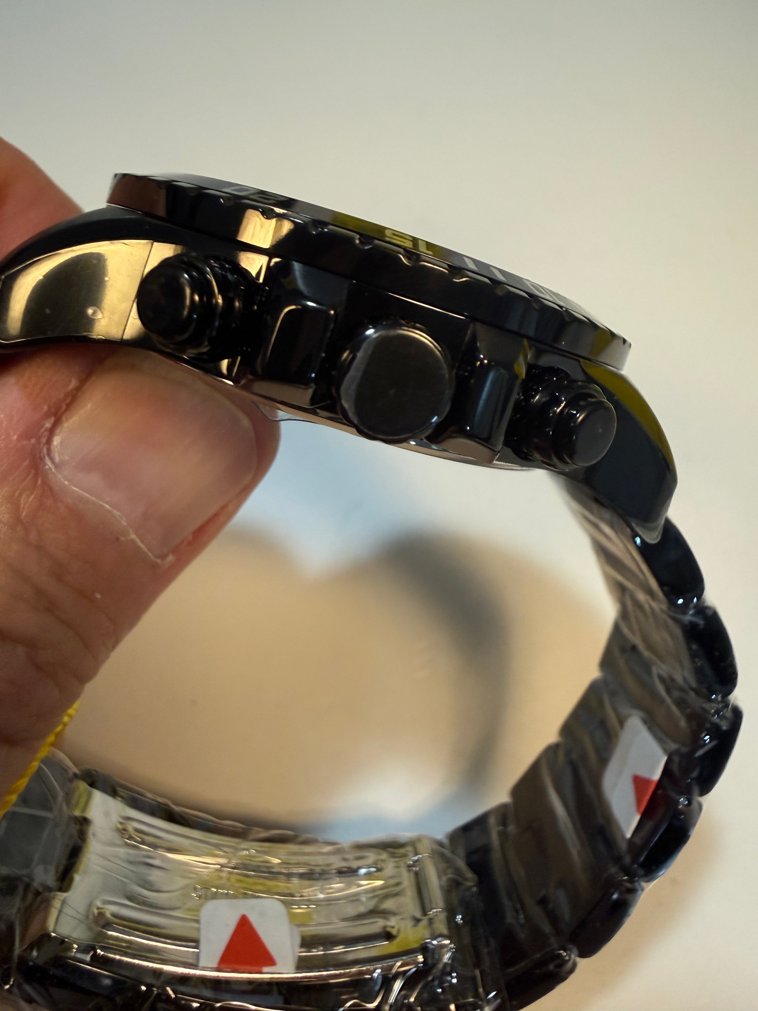 Close-up of a person holding a Invicta Mens Specialty Fortitude  with a blurred background