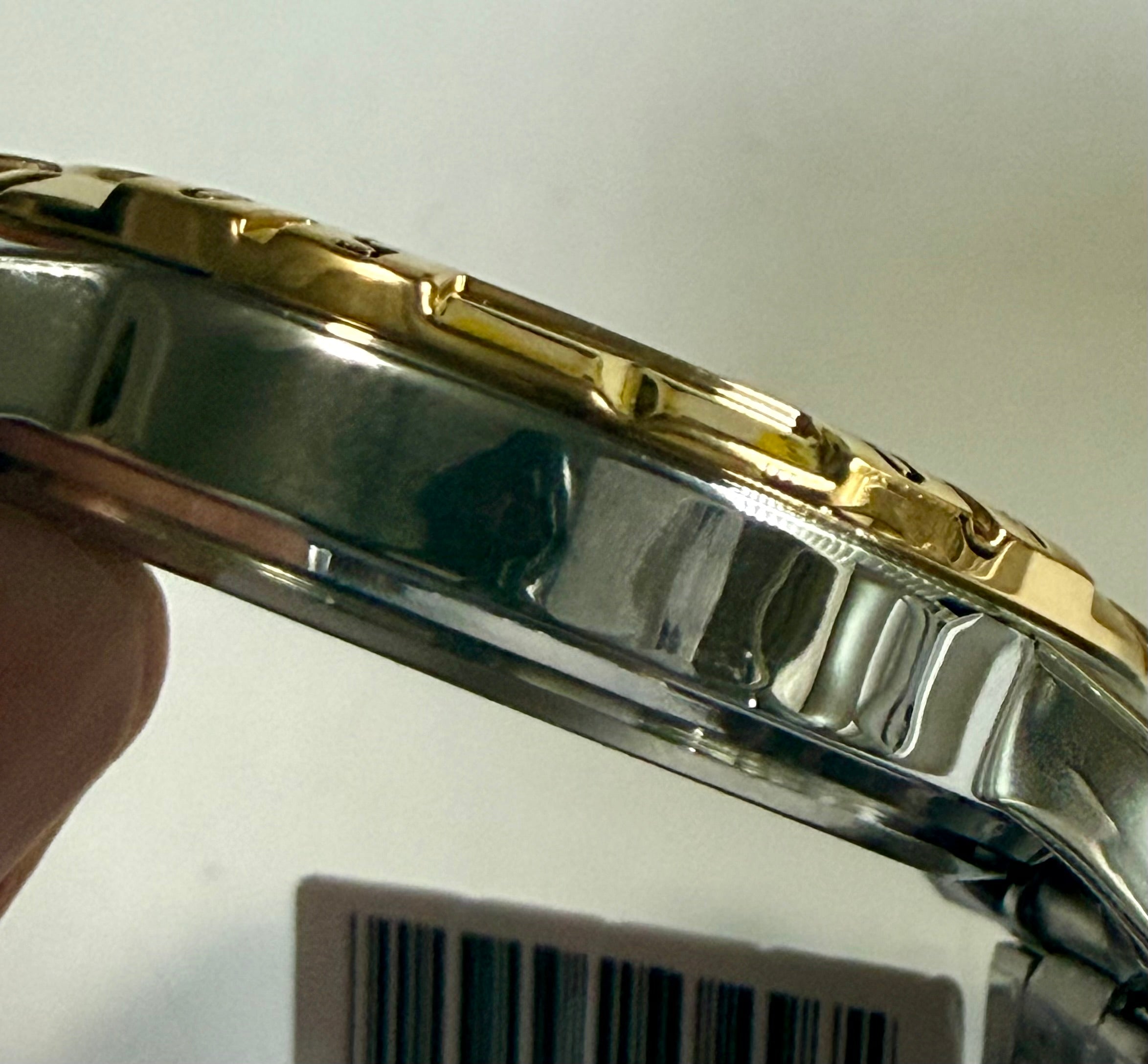 Close-up of aInvicta Specialty I Mens 42mm case held by a hand with a white background.
