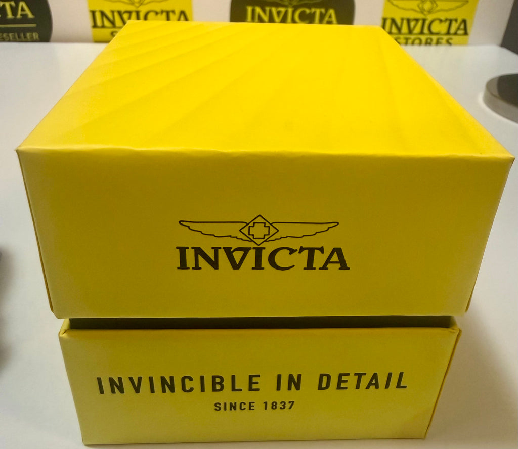 Yellow Invicta watch box with brand logo on a white background