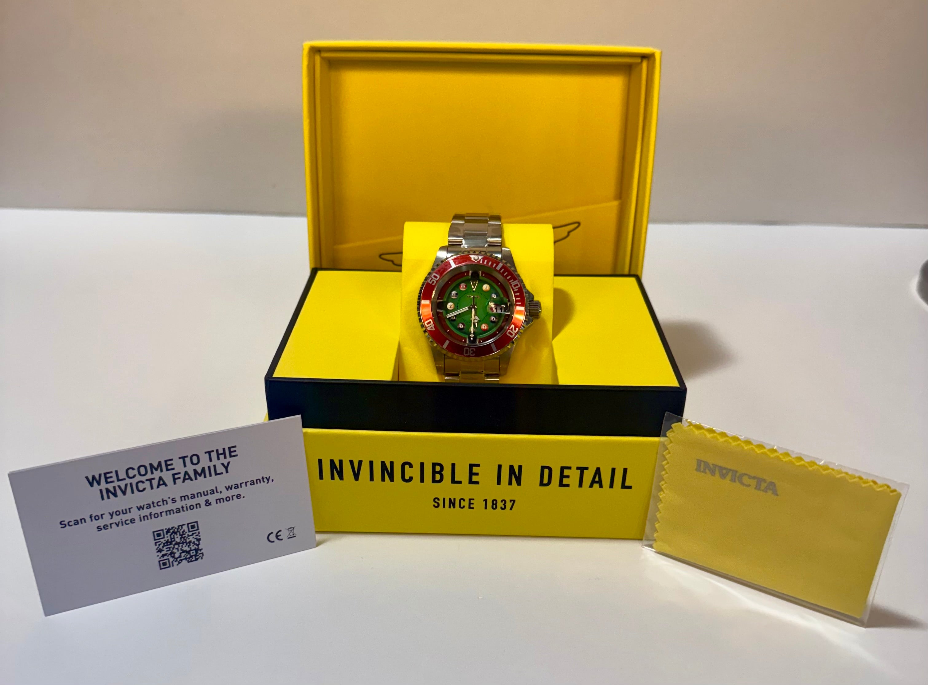 Invicta Pro Diver House of Cards Men's Watch - 40mm. with yellow box and accessories on a white surface