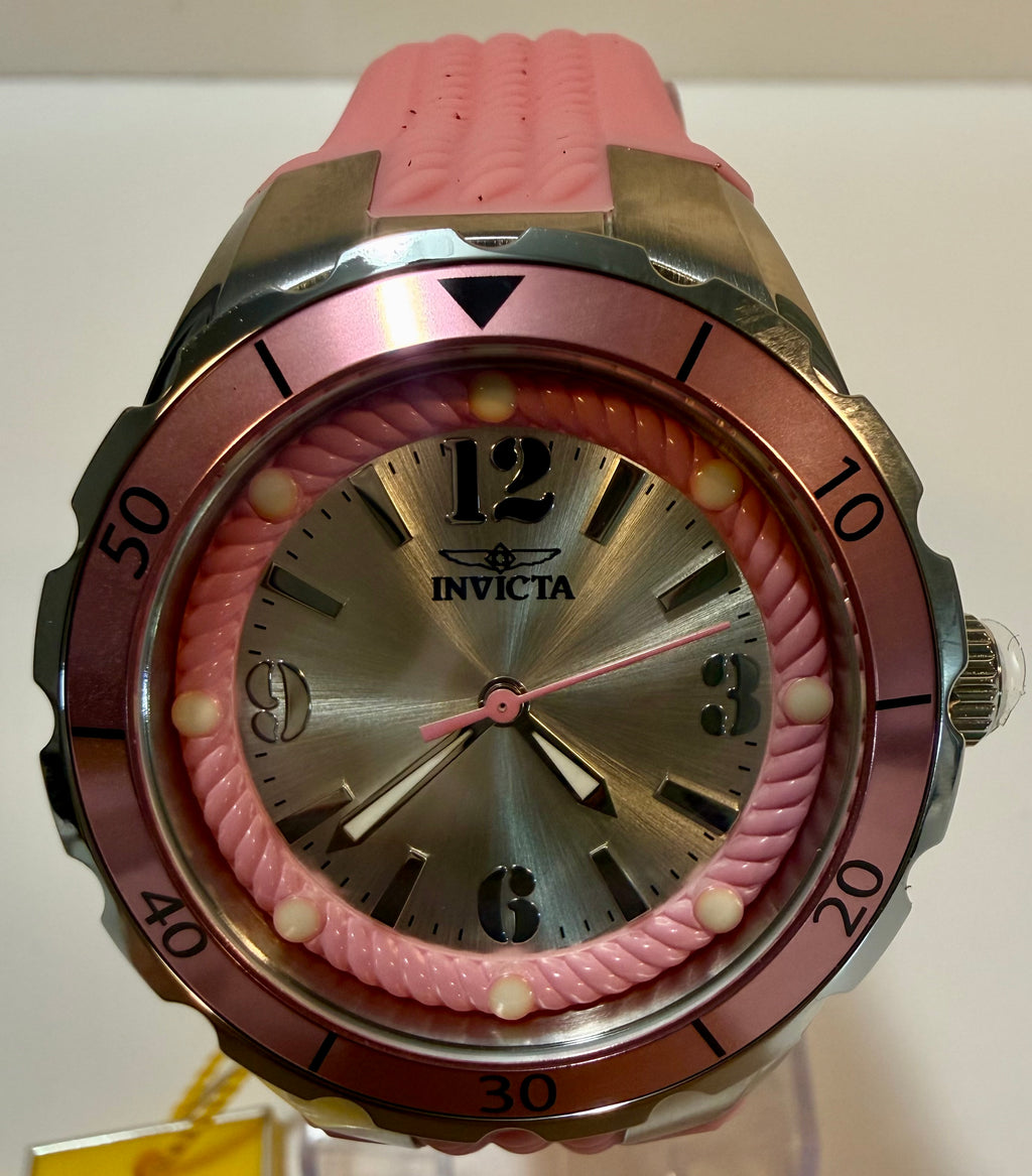 PinkInvicta watch with silver face on a white background