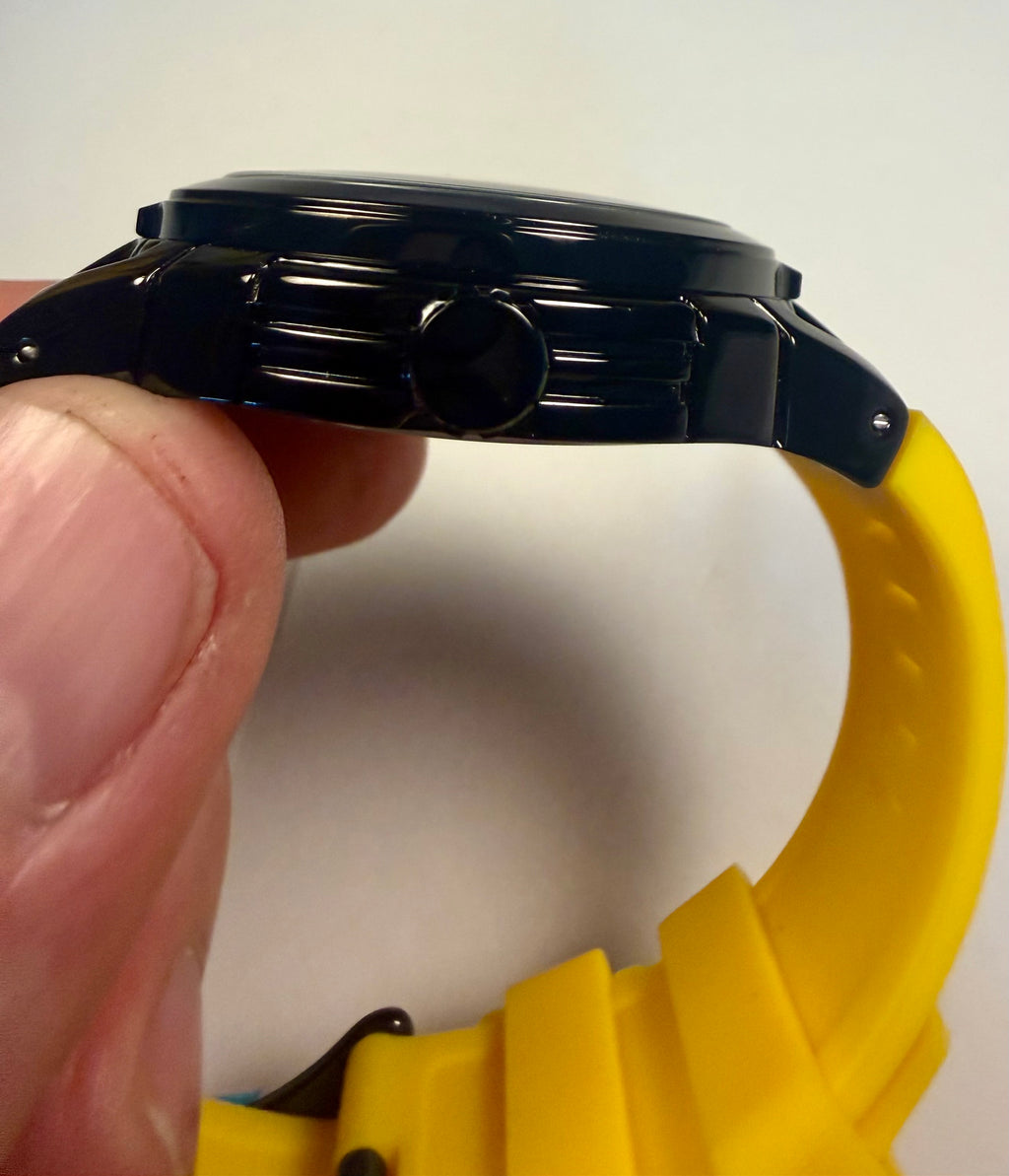 Activa ACW9549-006 Electric Yellow Skeleton Dial 44mm Black Silicone Sport NIBYellow wristwatch with a black case held by a hand against a white background