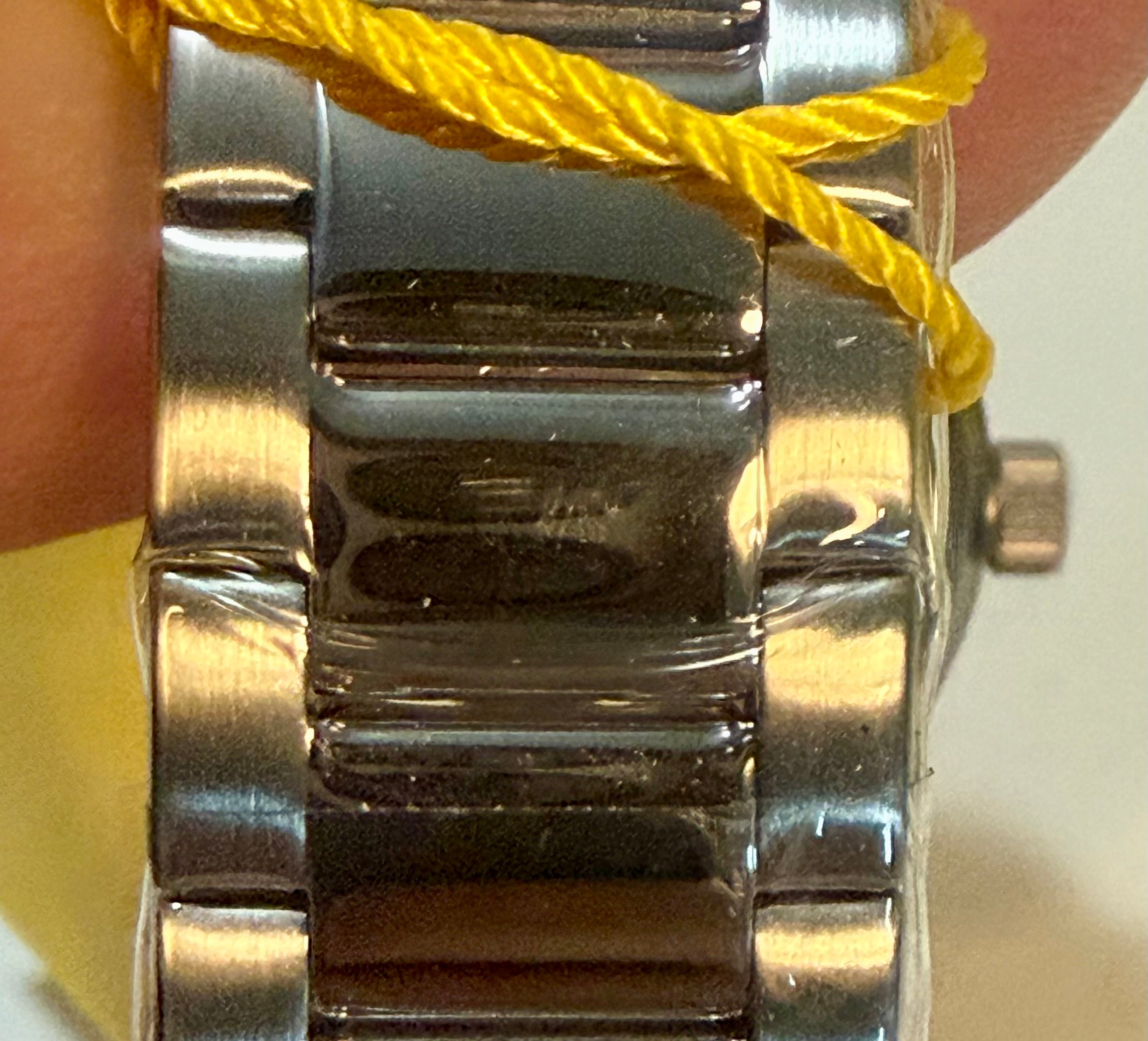 Close-up of a Invicta Ocean Voyage 41mm  band with a yellow strap