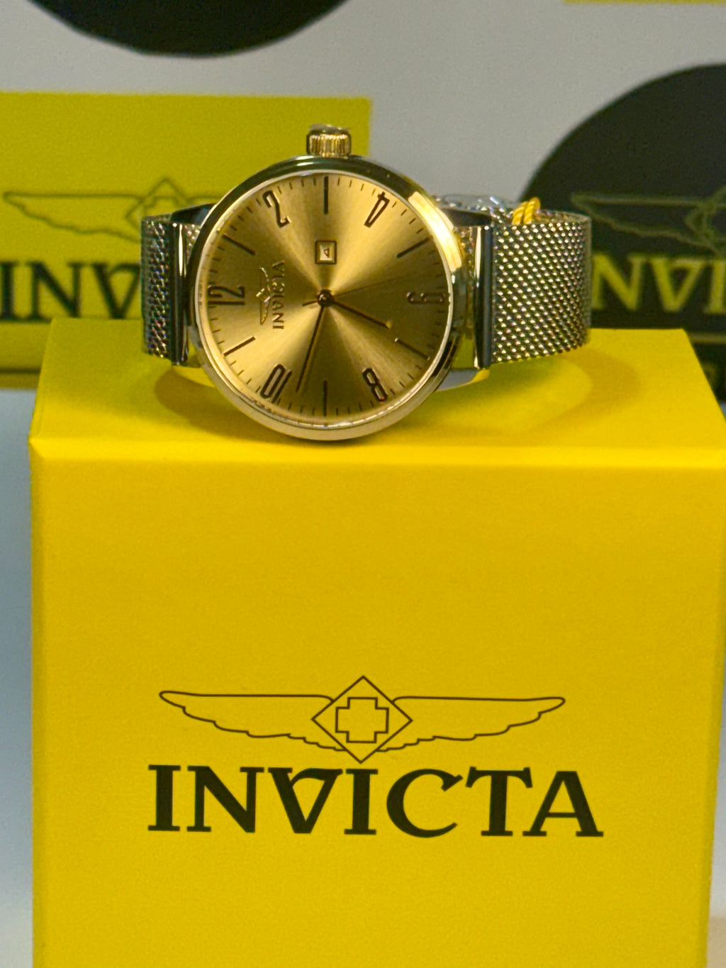 Invicta Mens Specialty Gold watch on a yellow Invicta box