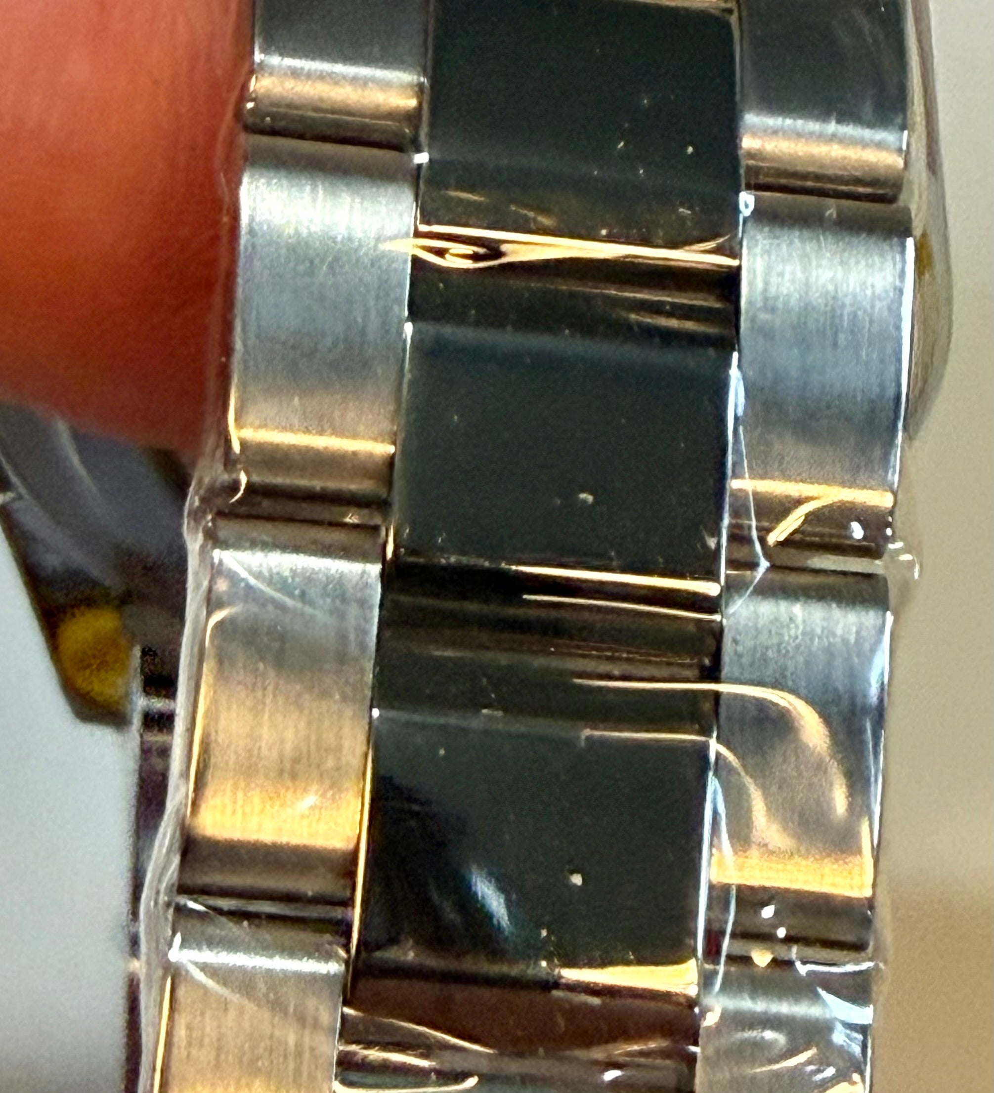 Close-up of aInvicta Speedway Torvane 17025 Men 39.5mm Chrono Steel Watch Black Textured Dial with a blurred background