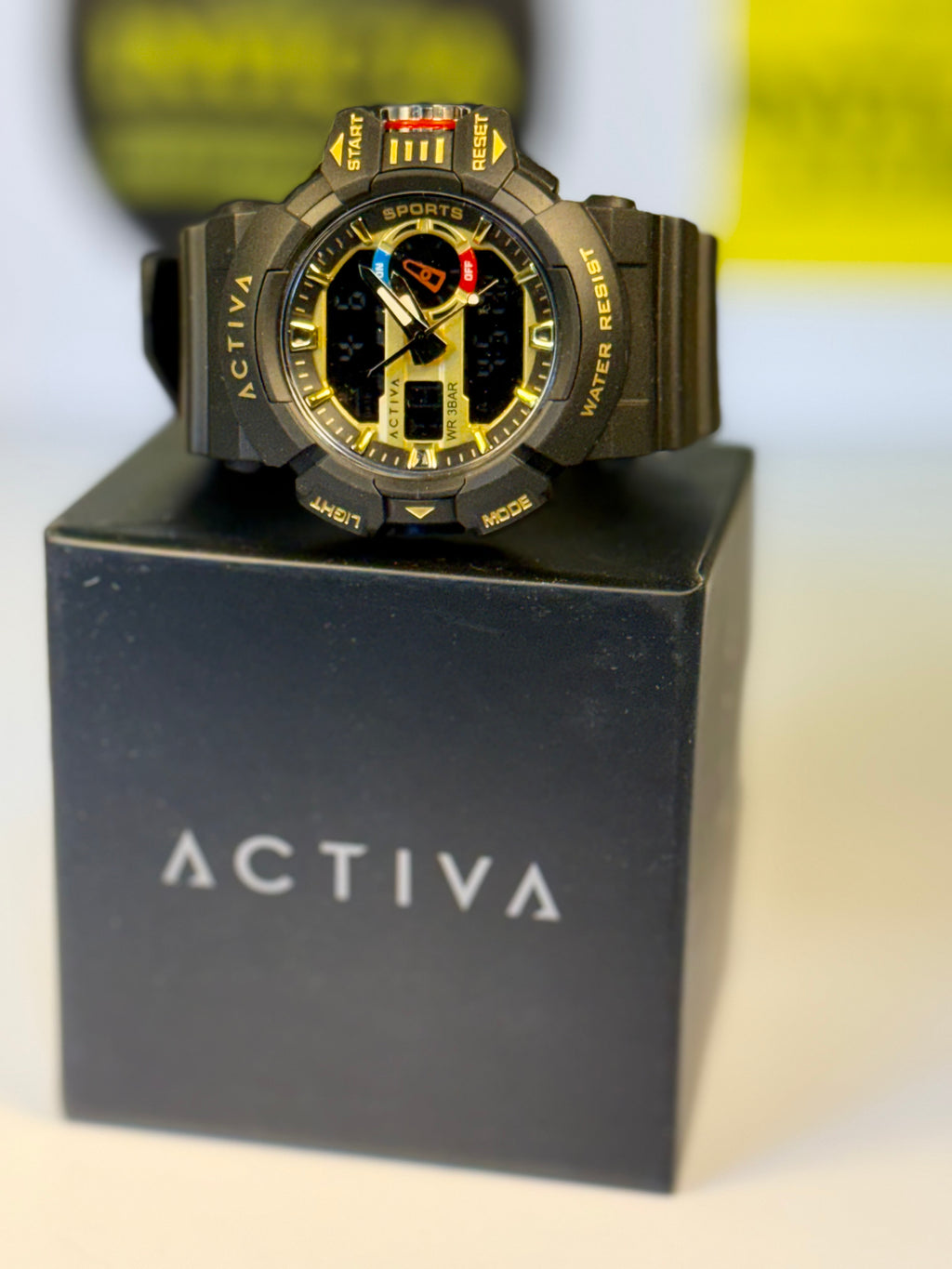 Invicta Activa Vord X watch on a black stand with a blurred background
