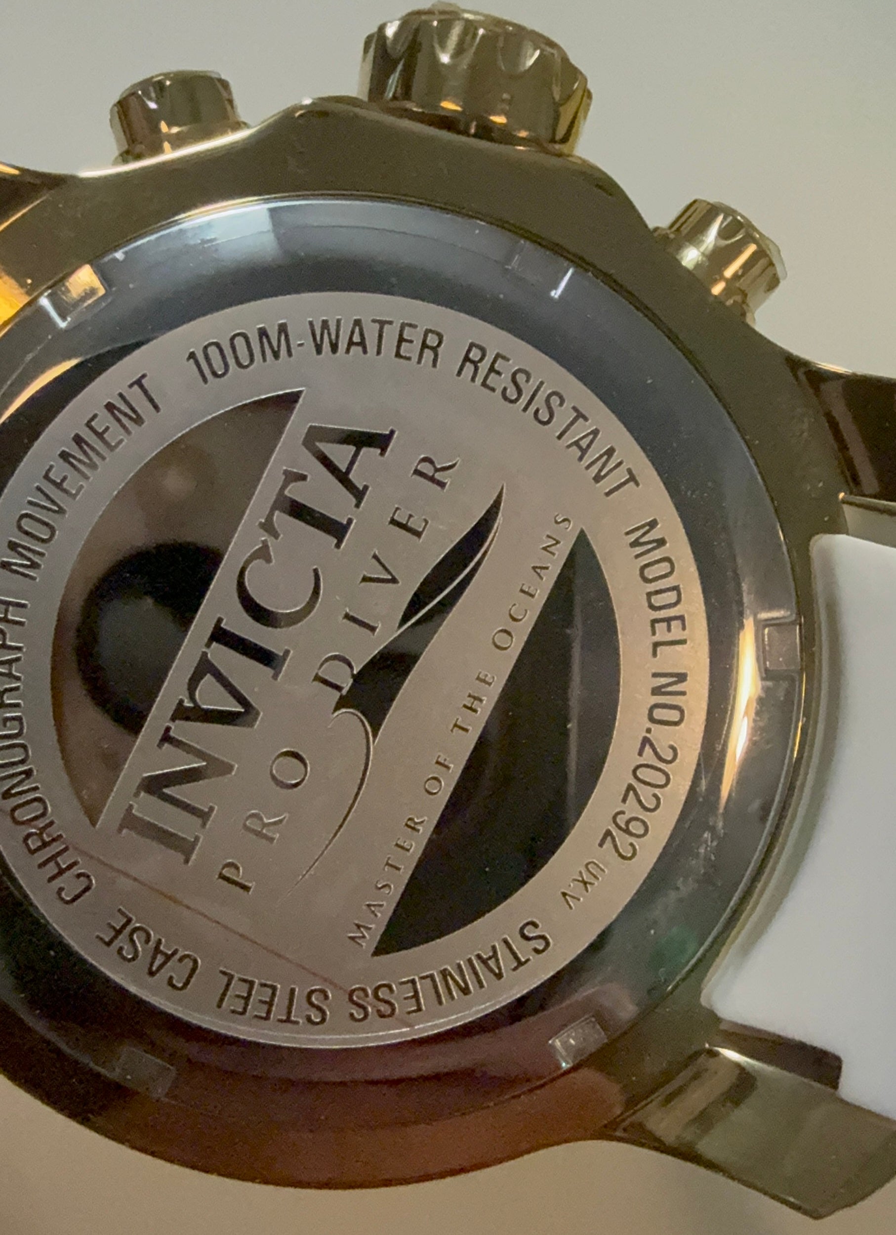 Back of an Invicta Pro Diver watch with branding and model details.