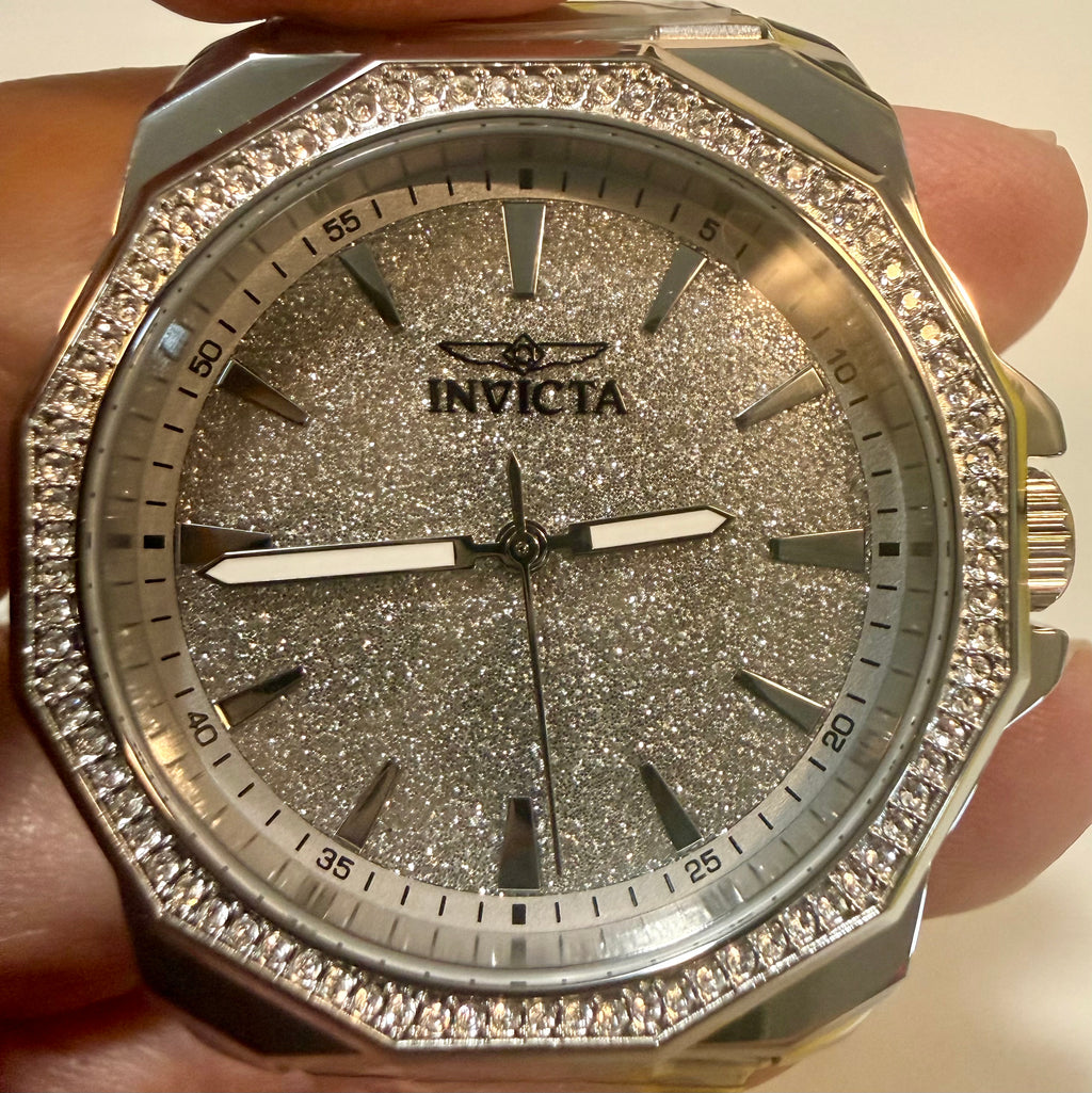 Invicta Speedway 42mm Mens Watch watch with glittery face and diamond-studded case held in hand