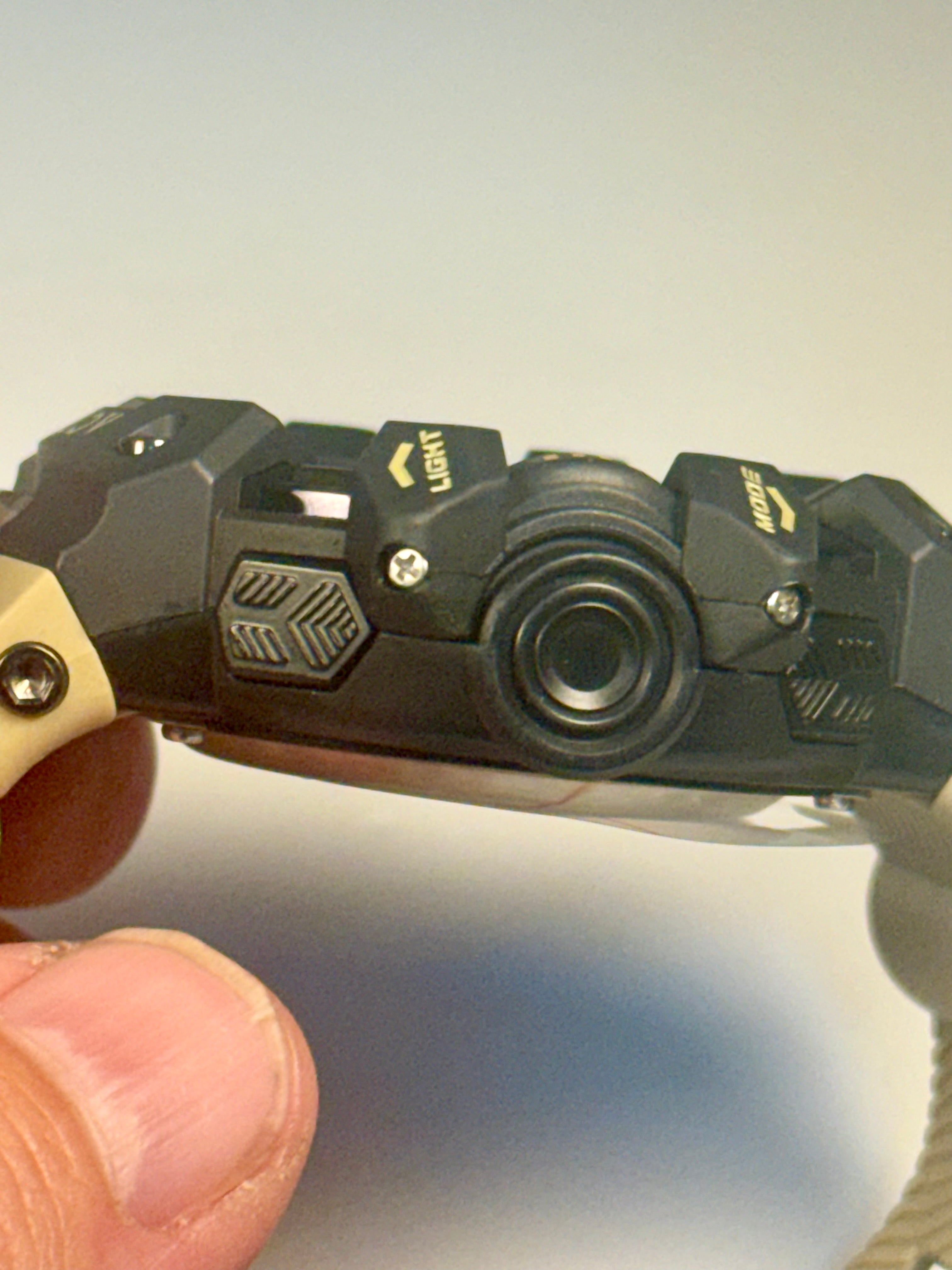 Activa Camo Sport Watch with tactical design held by a hand against a neutral background