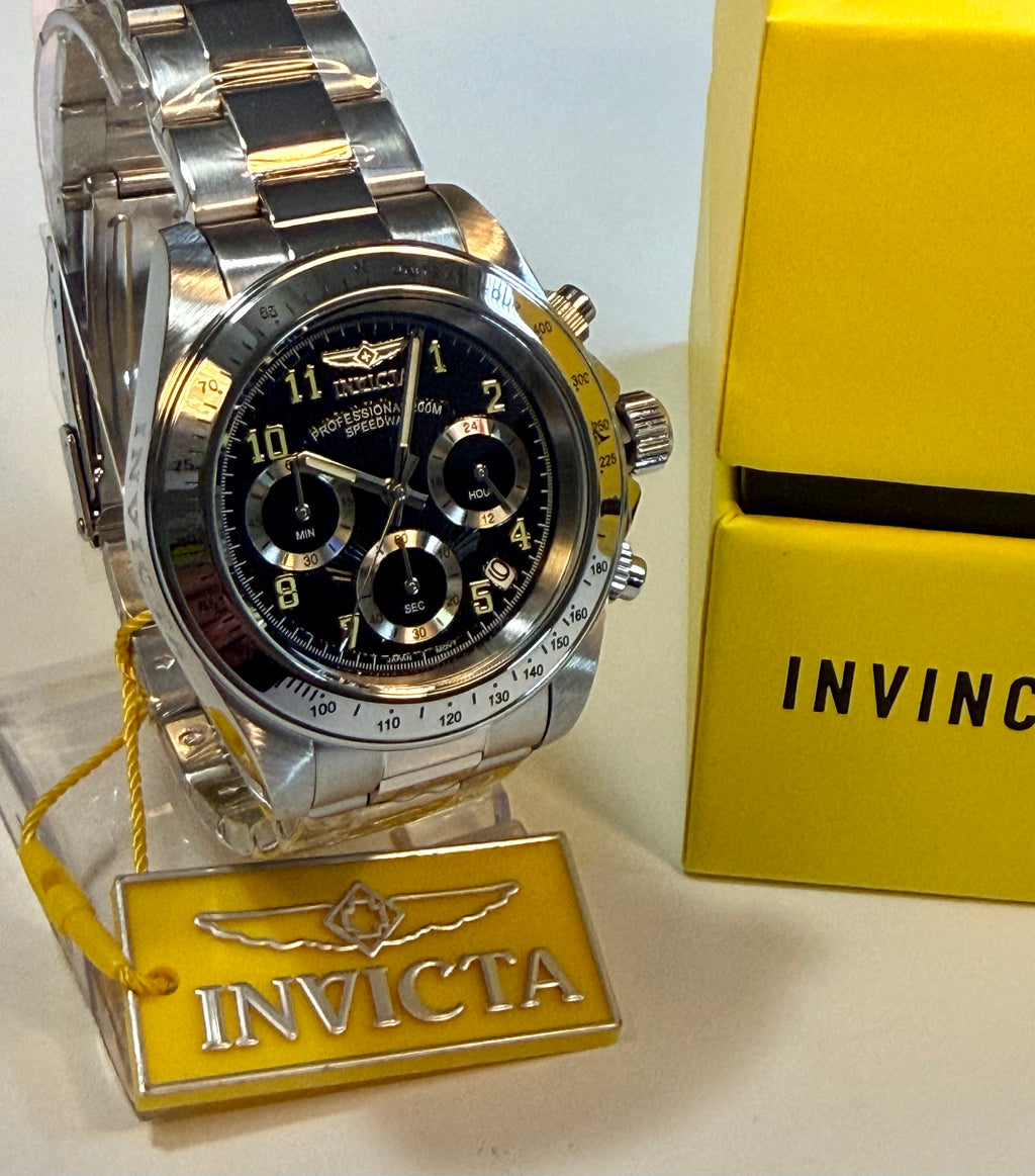 Invicta Speedway Torvane 17025 Men 39.5mm Chrono Steel Watch Black Textured Dialwith black face on a stand next to a yellow box
