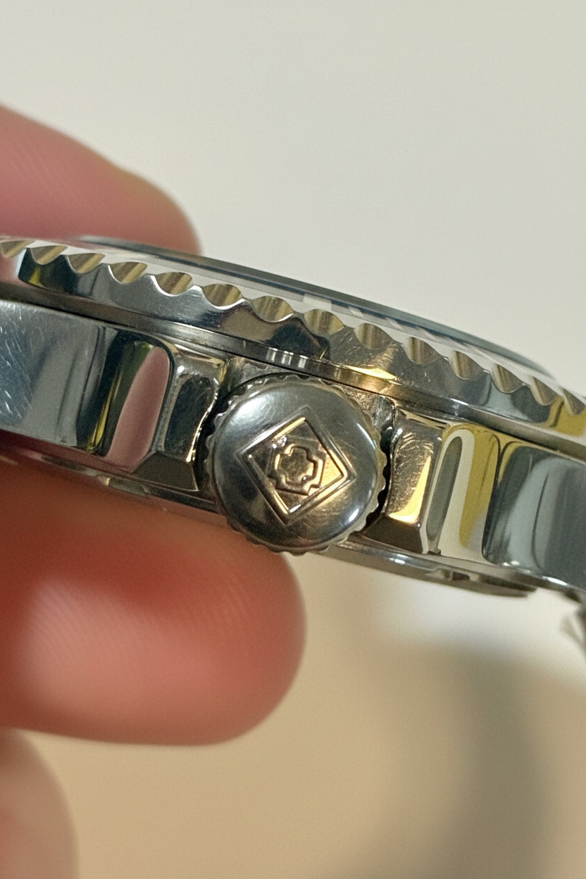 Close-up of a Invicta Pro Diver 47356 Men 40mm Quartz Turquoise Blue Dial Steel Sport Watch band with a person's finger holding it.