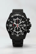 Invicta Mens Specialty Fortitude Black watch with detailed face on a white surface, Invicta box in the background