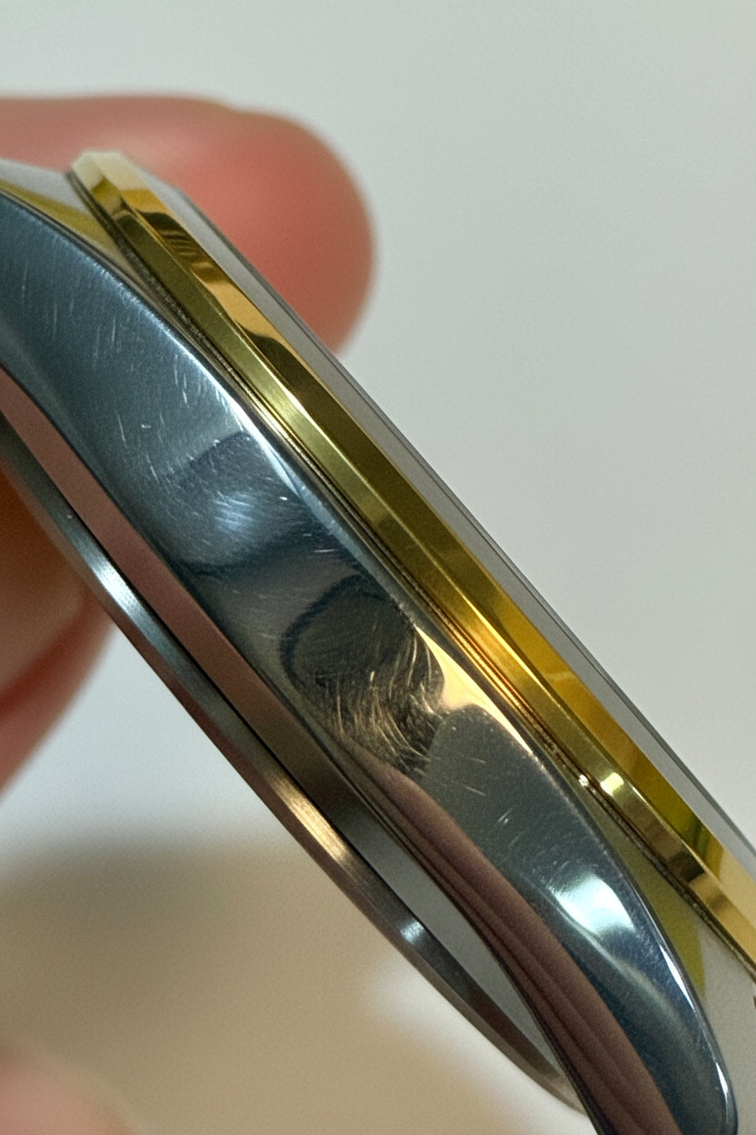 Close-up of a pInvicta Ocean Voyage 41mm held by a hand on a light background