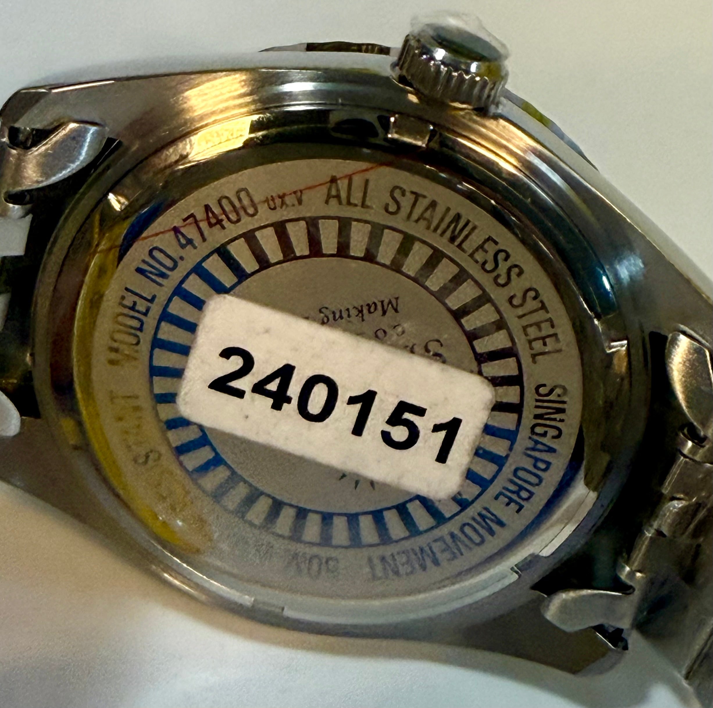Back of a Invicta Specialty Windsor 43mm with visible branding and model number on a white background