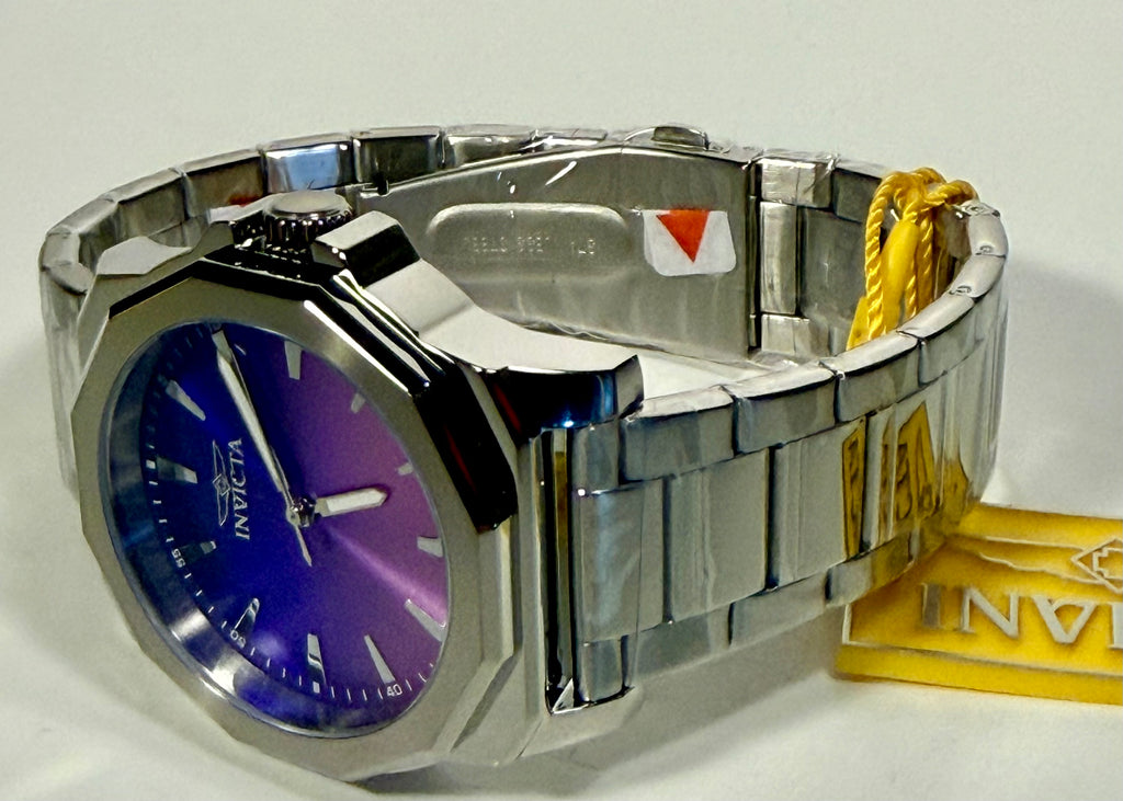 50981 Invicta Men's Speedway Dominus 42mm Stainless Steel Iridescent Dial Watch lying on flat surface