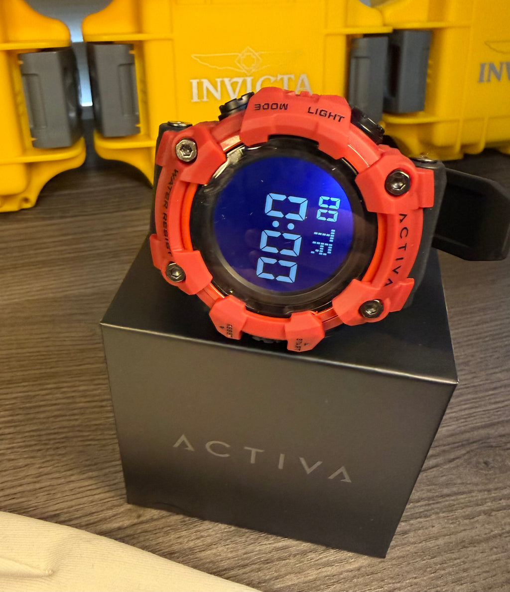 Red digital Activa  watch on a black box with Invicta background