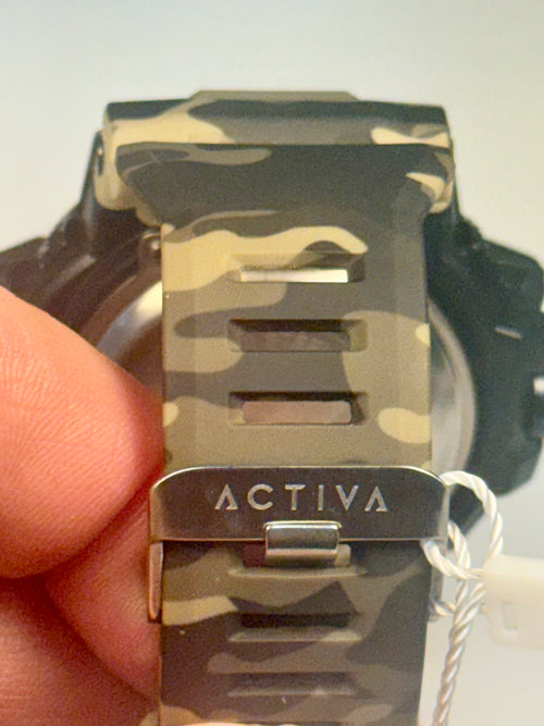 Activa Camo Sport Watch Camouflage watch band with 'Activa' branding held by a hand against a light background