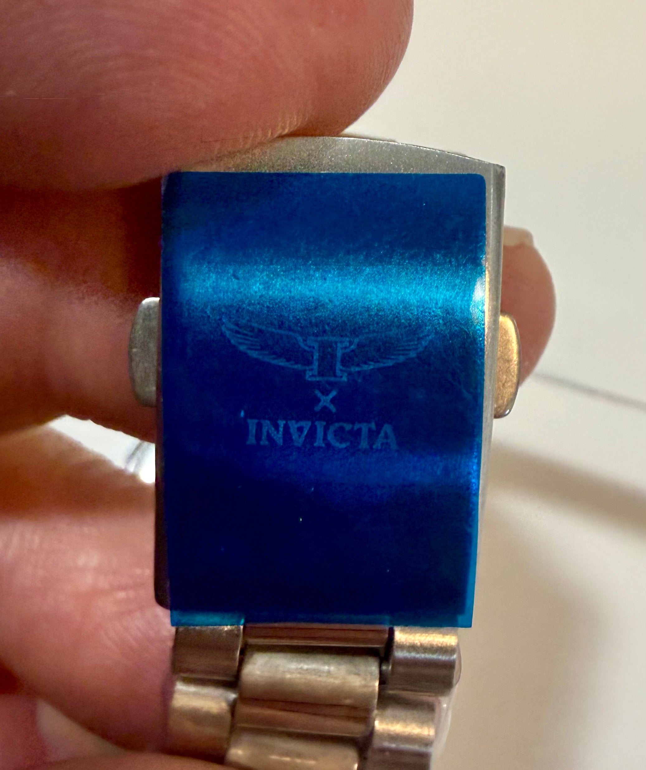 Close-up of a Invicta Mens Specialty I 40mm  band with a hand holding it.