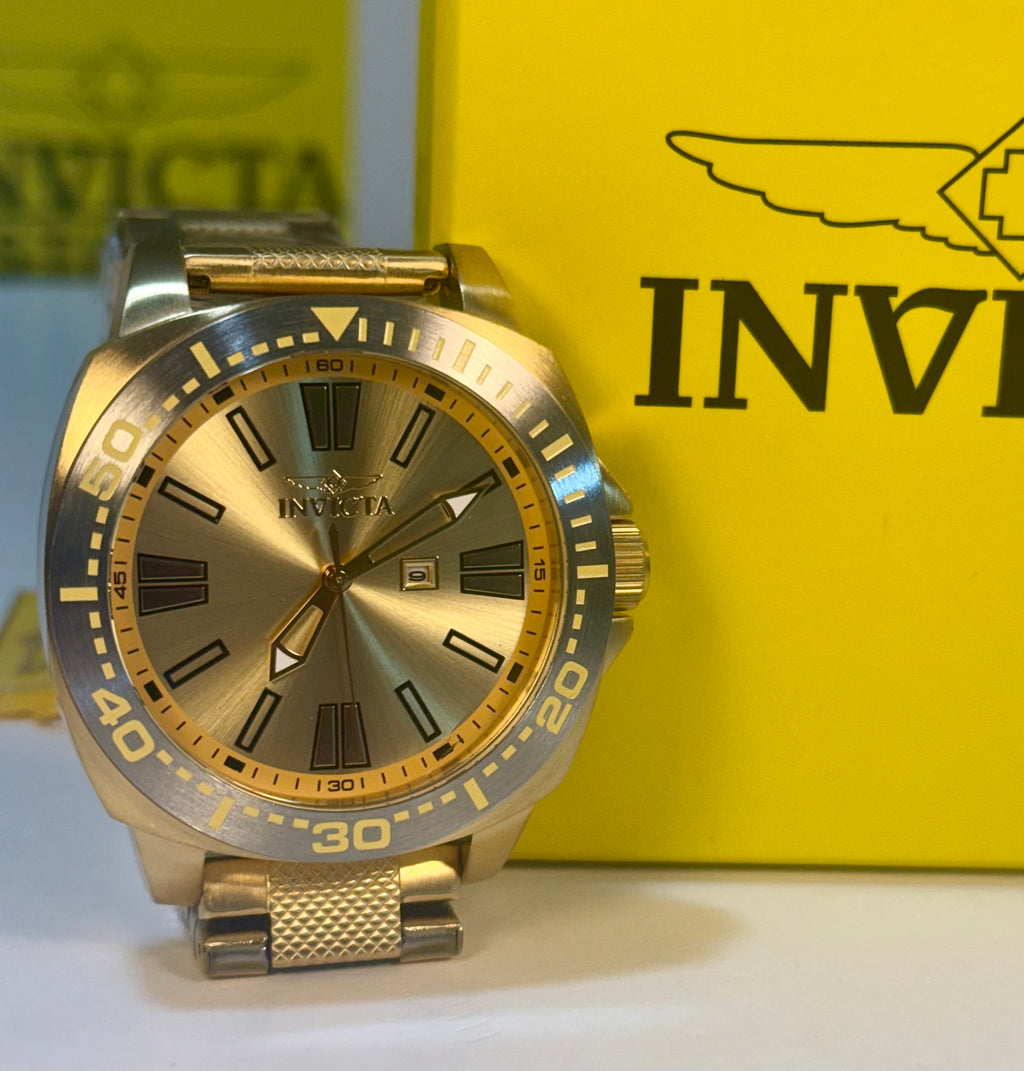 Gold Invicta Speedway 48mm watch with a yellow box in the background