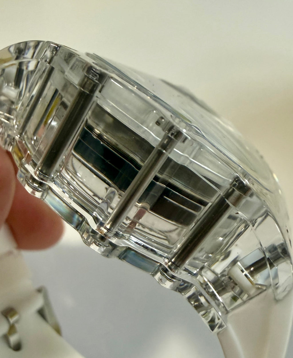 Close-up of a crystal-clear Mens Invicta Racing Vaulthan 44mm with a white background