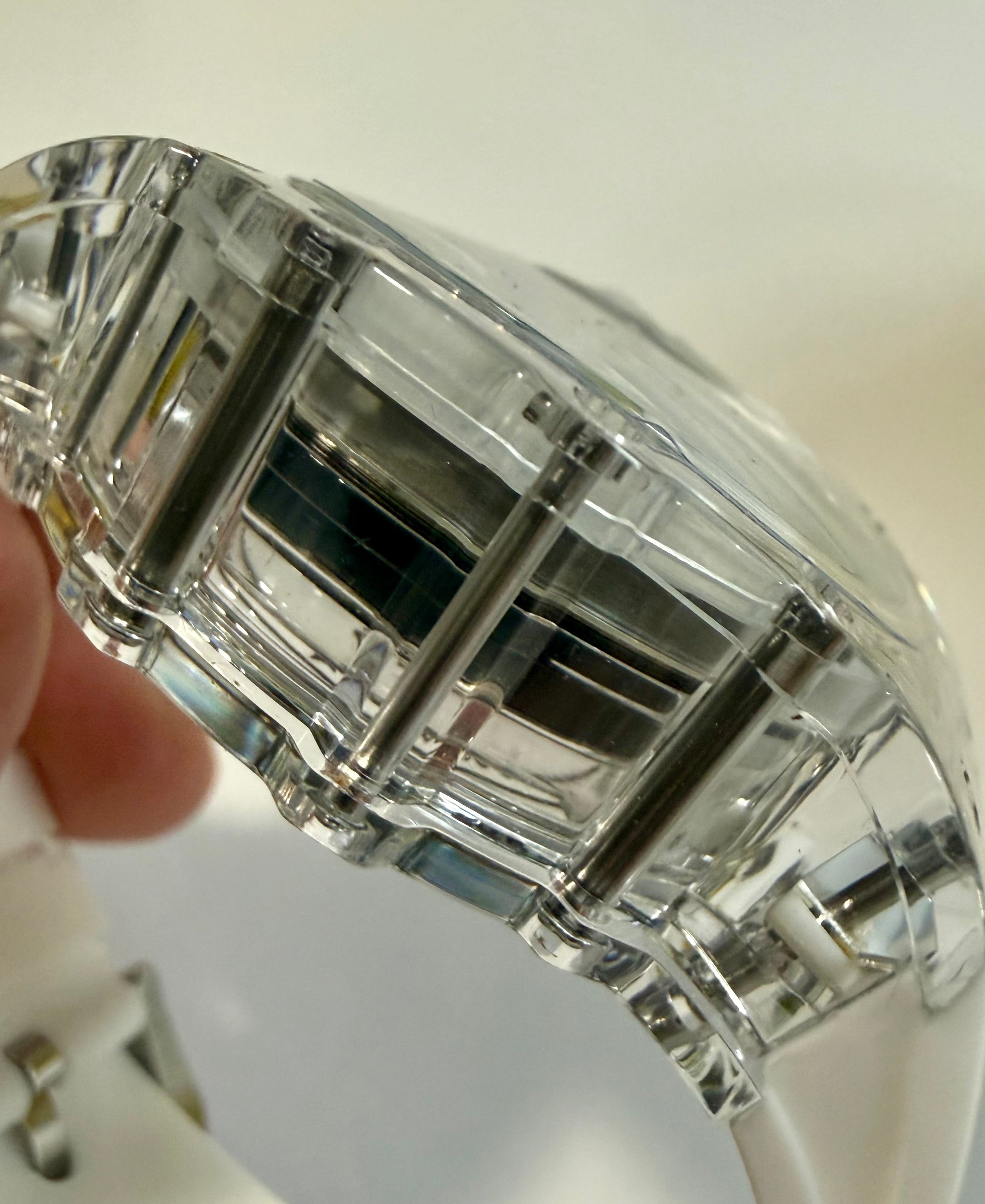 Close-up of a crystal-clear Mens Invicta Racing Vaulthan 44mm with a white background