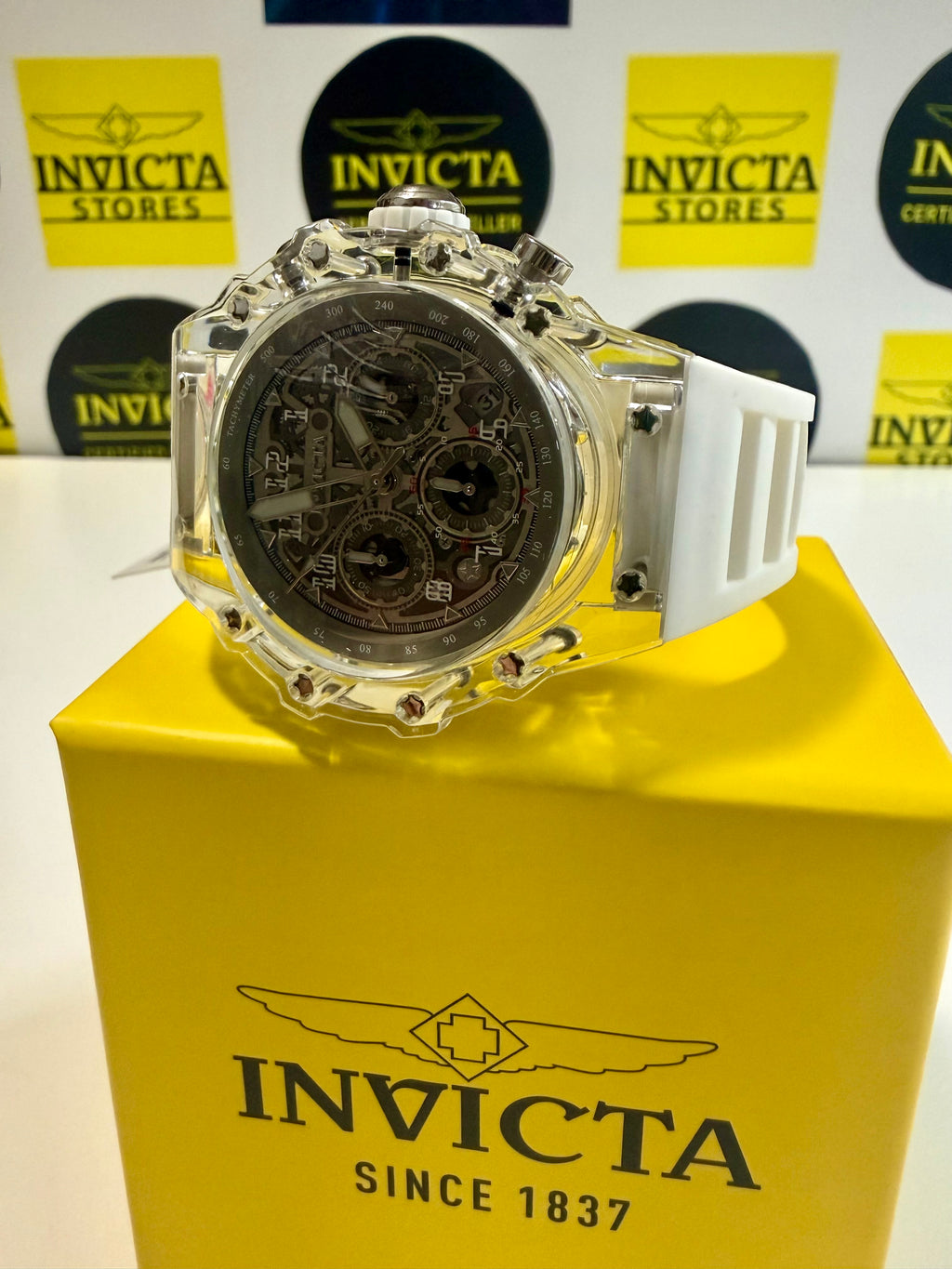 Mens Invicta Racing Vaulthan 44mm Invicta watch on a yellow box with Invicta branding in the background