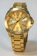 Invicta Speedway 48mm Gold wristwatch with a clear plastic cover on a light gray background