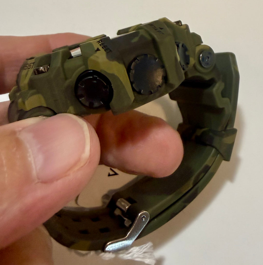 Activa X Black Ops 52mm Camouflage digital watch with a person holding it