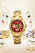 Invicta Speedway Monte Carlo Gold wristwatch with a red face on a white background