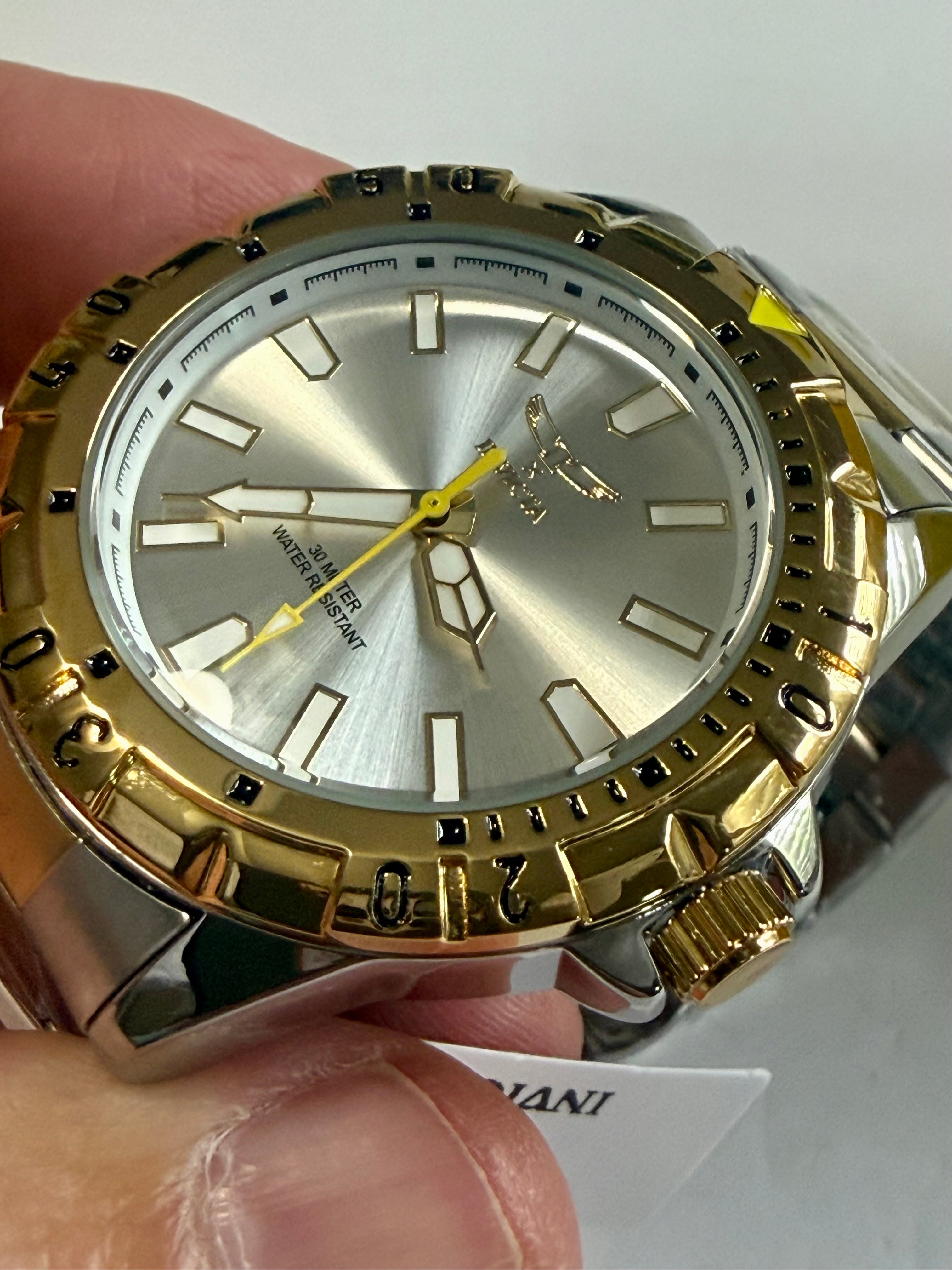 Invicta Specialty I Mens 42mm Gold and silver watch held by a hand with a white background